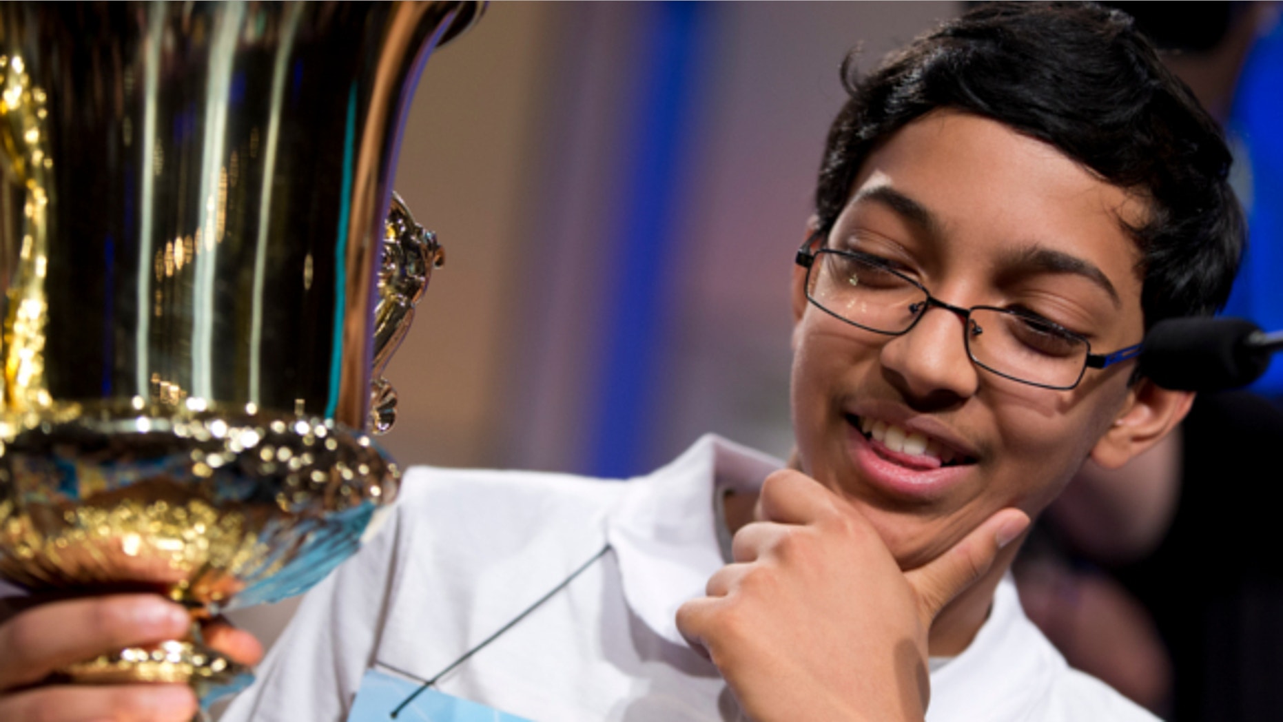 May 30, 2013: Arvind Mahankali, 13, of Bayside Hills, N.Y., holds the championship trophy after he won the National Spelling Bee by spelling the word "knaidel" correctly in Oxon Hill, Md.