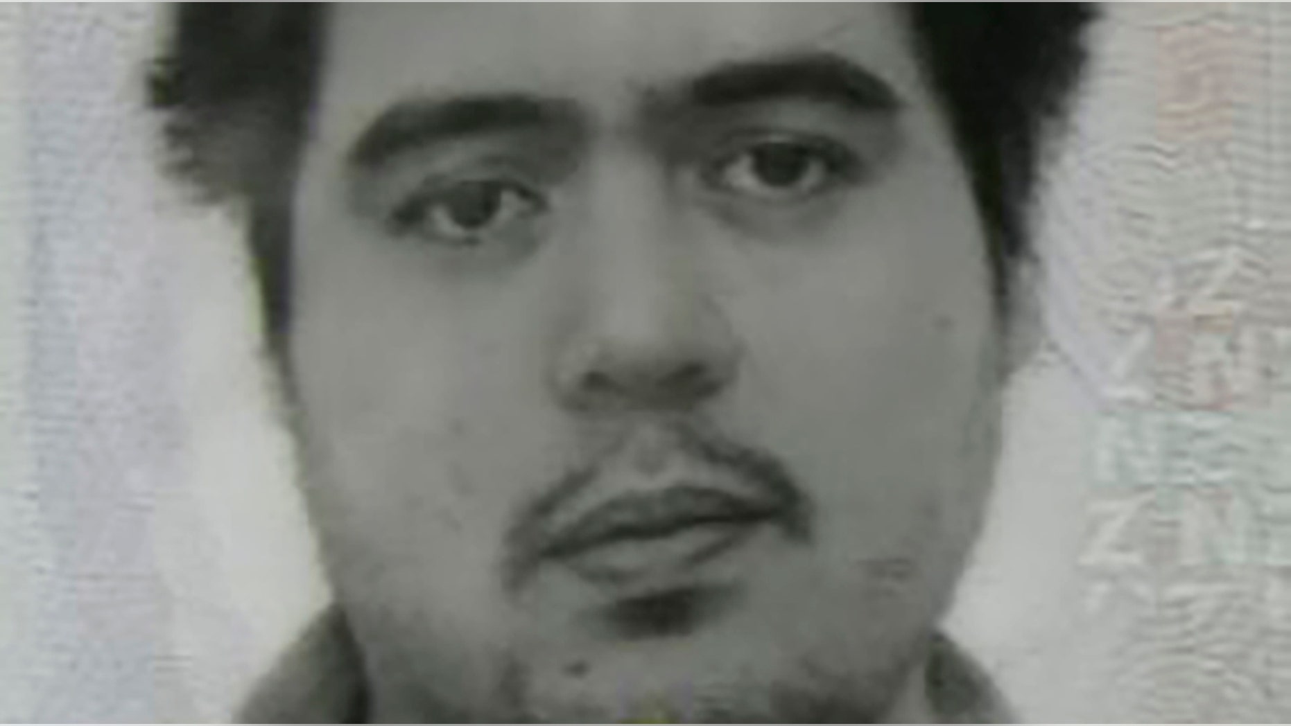 This photo provided by the Goochland County Sheriff's Office shows a New Zealand passport photo, of Troy George Skinner.