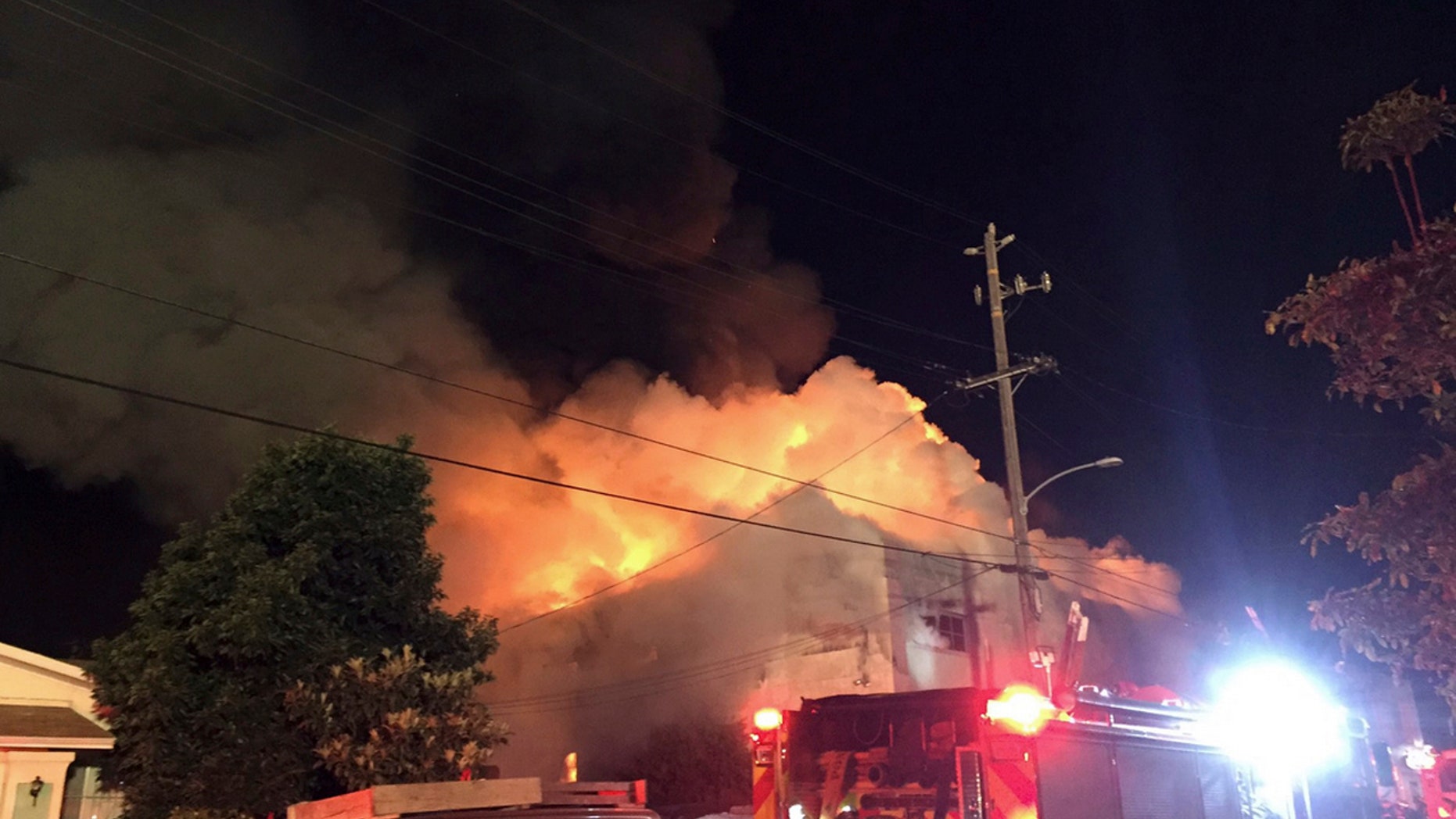 This photo provided by @seungylee14 shows the scene of a fire in Oakland, early Saturday, Dec. 3, 2016.