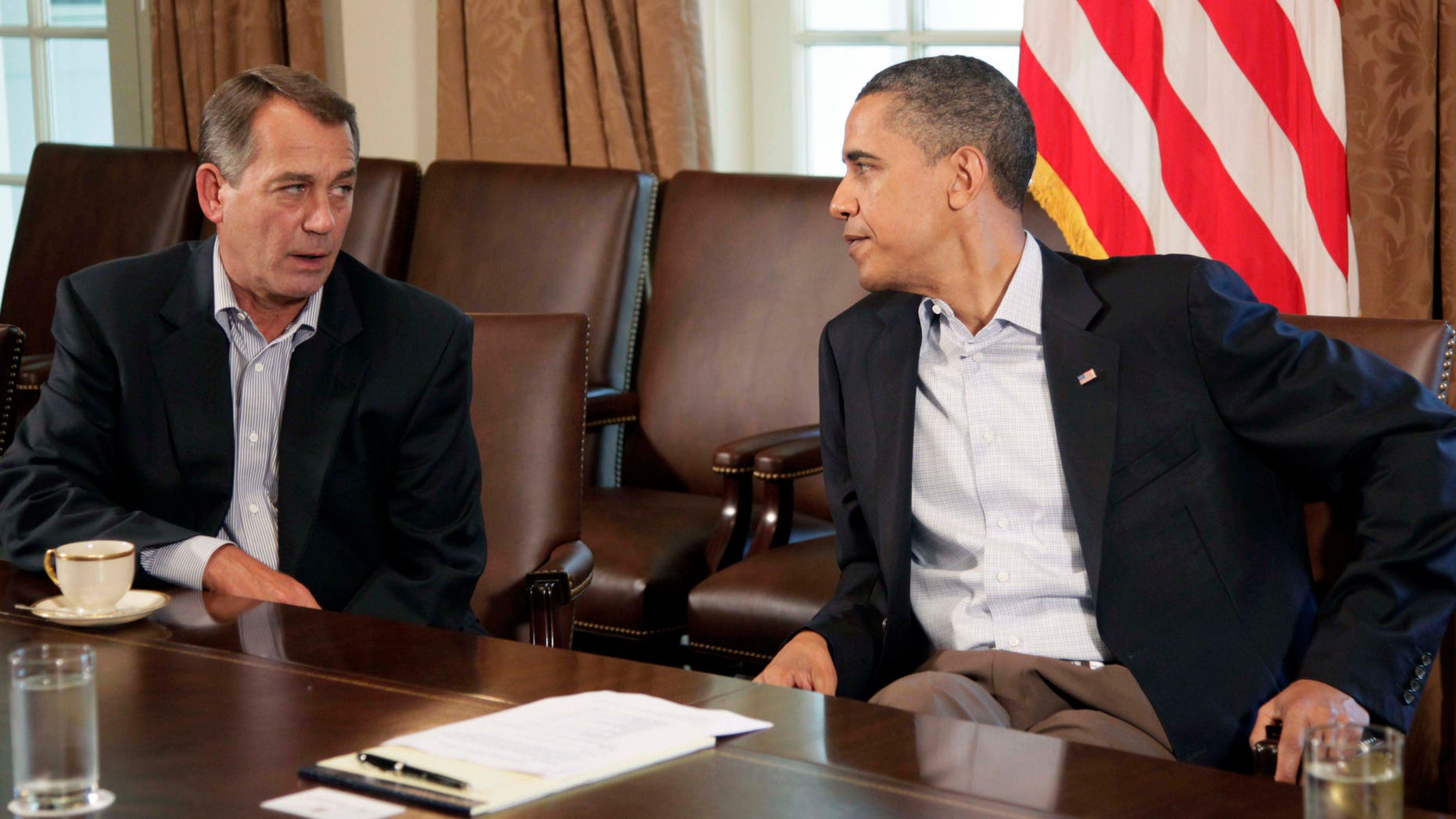 FILE: July 23, 2011: President Obama and House Speaker John Boehner.