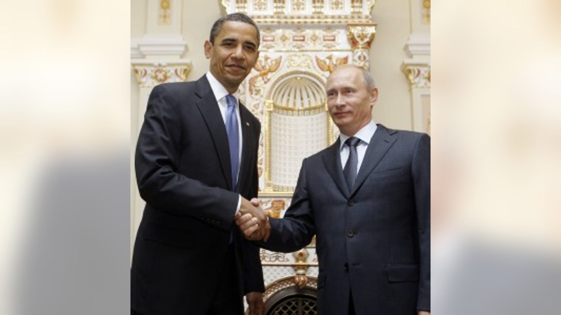 President Barack Obama, left, shakes hands with Russian Prime Minister Vladimir Putin during a meeting at Novo Ogaryovo, Tuesday, July 7, 2009, in Moscow. (AP Photo/Haraz N. Ghanbari)