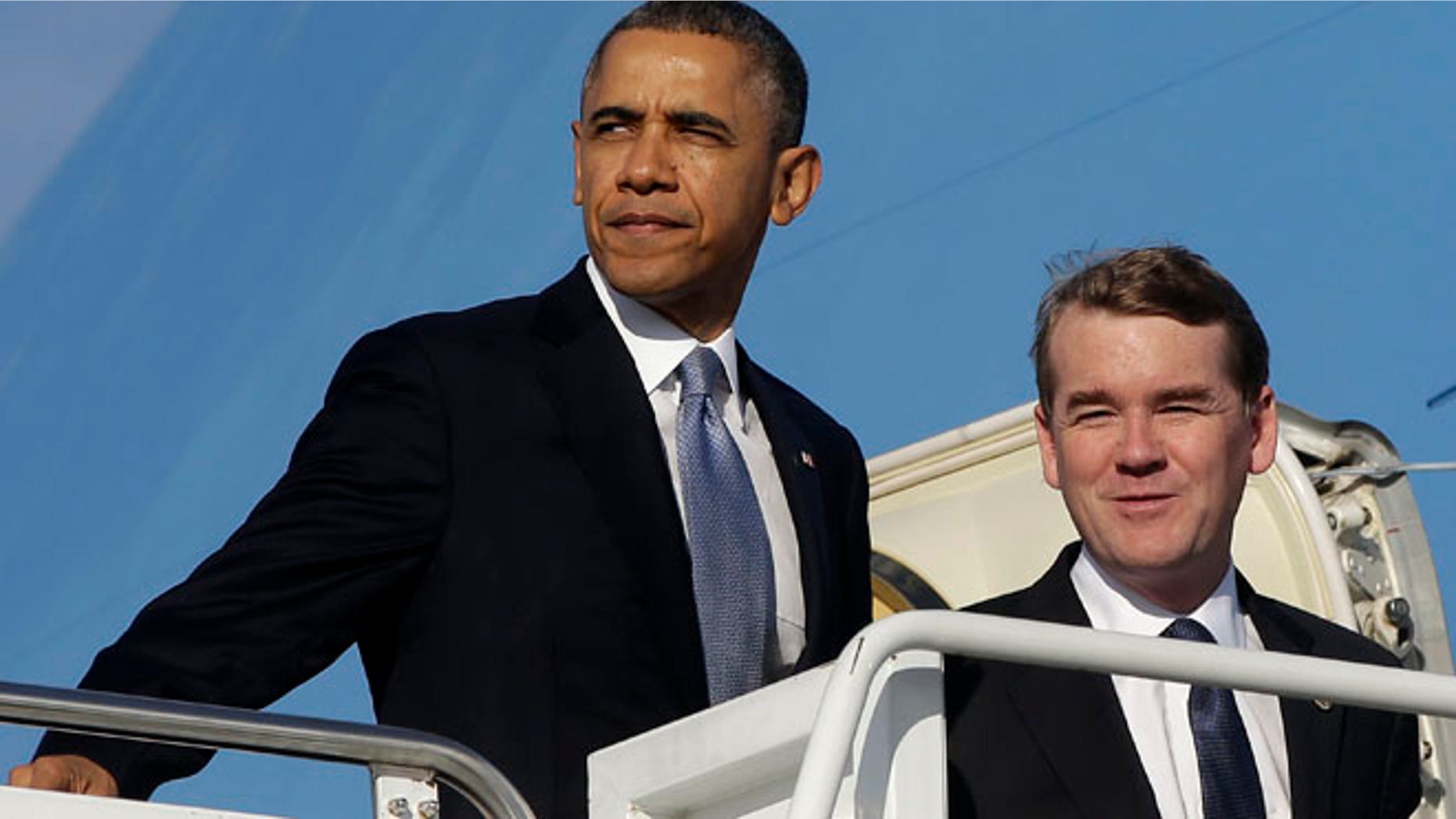 Nov. 6, 2013: President Barack Obama and Democratic Senatorial Campaign Committee Chairman Sen. Michael Bennett, D-Colo., board Air Force One at Andrews Air Force Base.