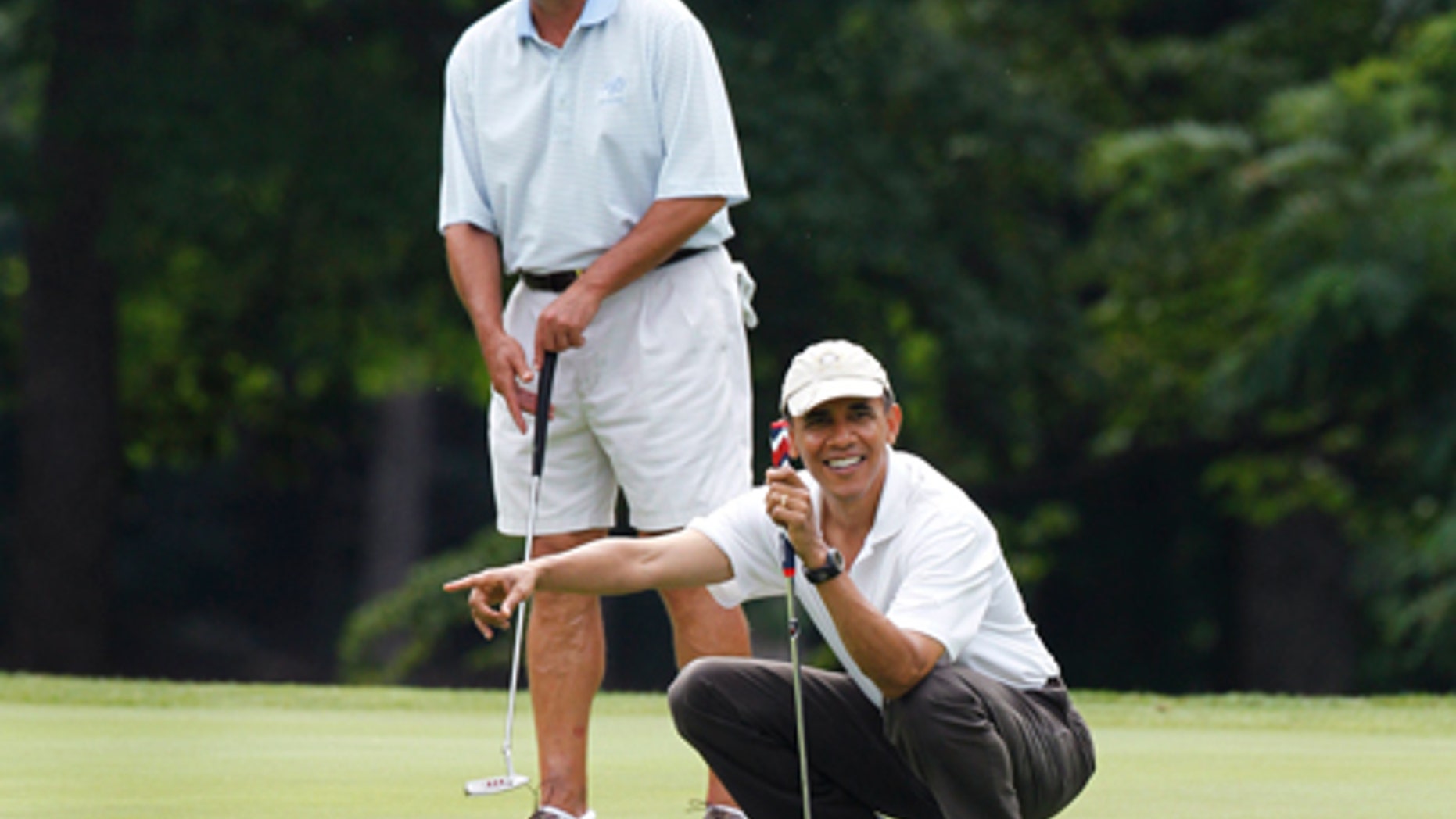 House Speaker John Boehner, R-Ohio, and President Obama enjoy a bipartisan golf match Saturday June 11. (AP Photo)