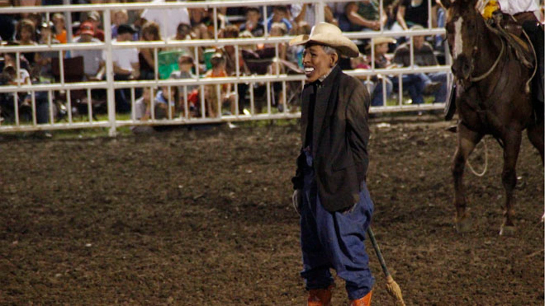 This photo provided by Jameson Hsieh shows a clown wearing a mask intended to look like President Obama at the Missouri State Fair.