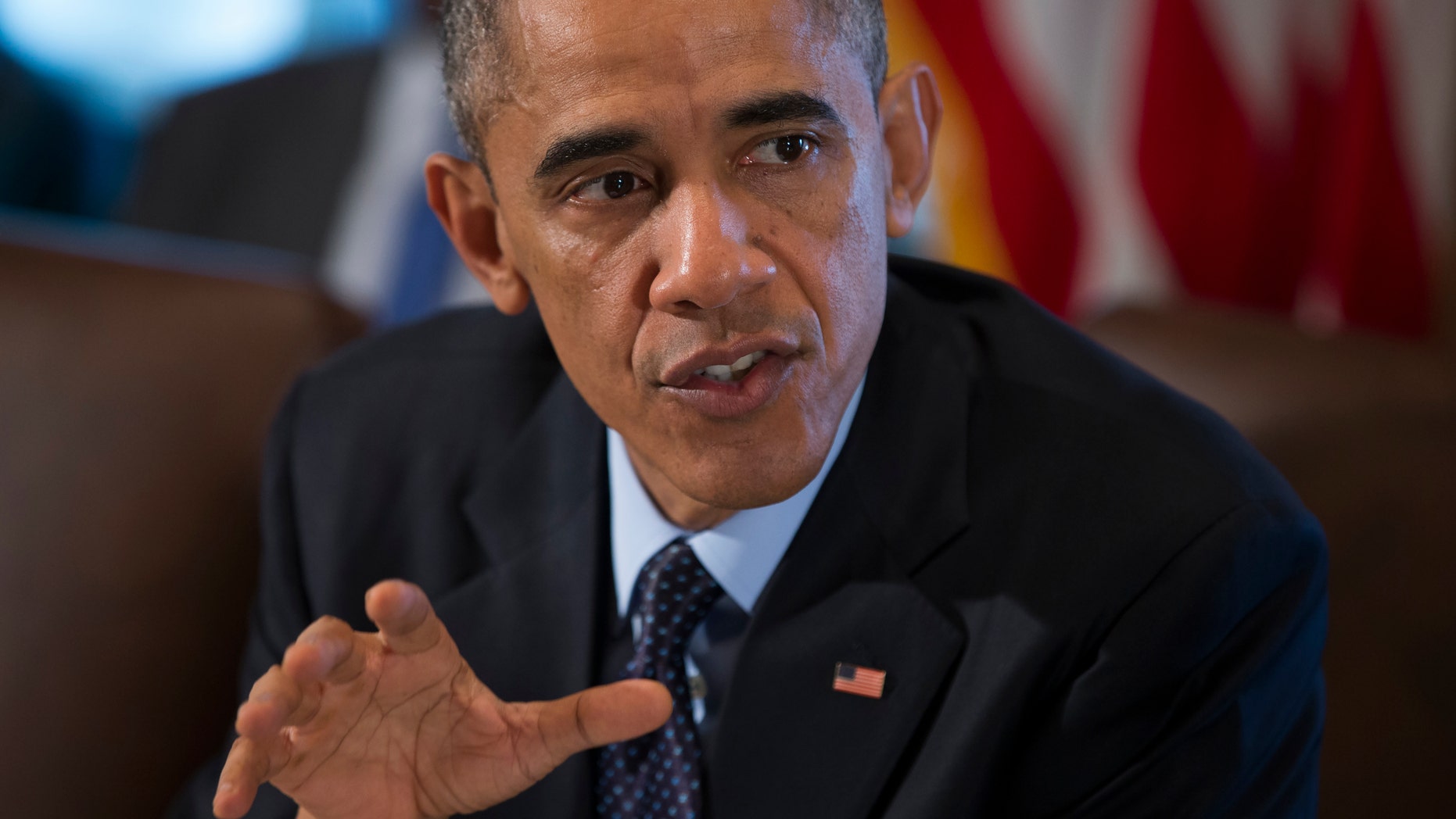 President Barack Obama speaks to the media before a meeting with his cabinet members in the White House Cabinet Room in Washington, Friday, Nov. 7, 2014. (AP Photo/Evan Vucci)