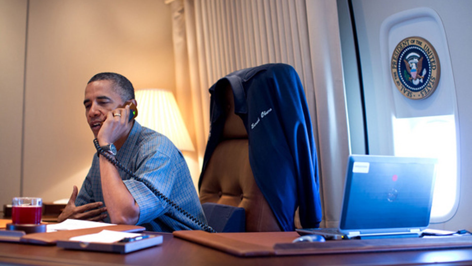 President Obama calls the NASA scientists behind the Curiosity Mars rover landing from Air Force One Aug. 13, 2012.
