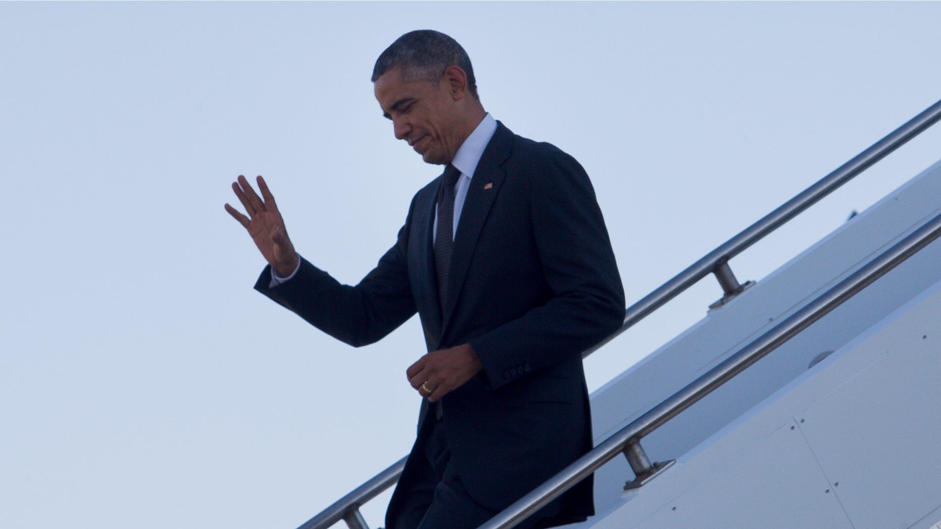 Nov. 15, 2014: U.S. President Barack Obama waves as he arrives at Royal Australian Air Force Base Amberley near Brisbane, Australia