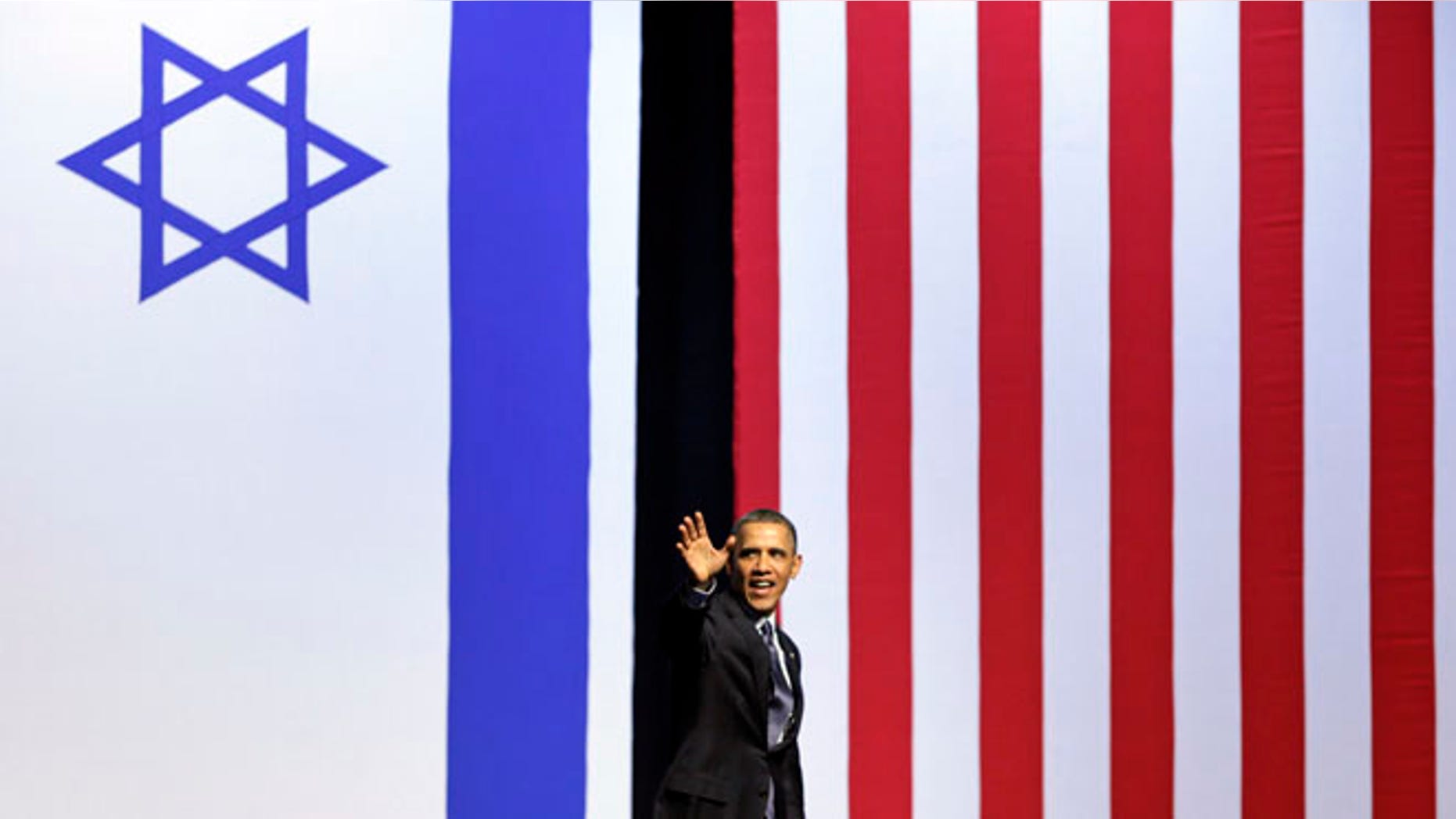 March 21, 2013: President Barack Obama waves as he leaves the stage after speaking at the International Convention Center in Jerusalem.