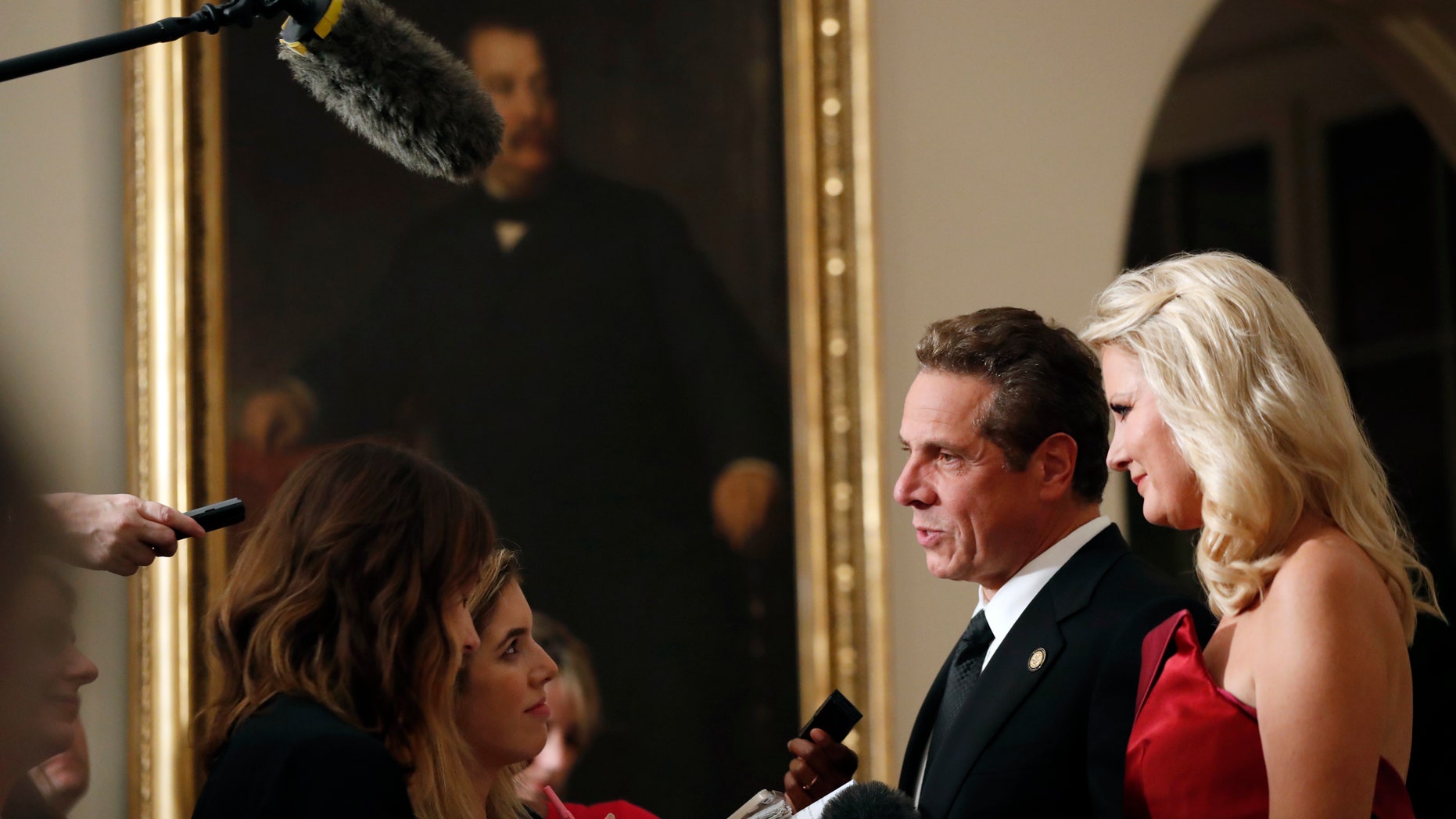 Oct. 18, 2016: Gov. Andrew Cuomo, D-N.Y., speaks to reporters with Sandra Lee, as they arrive for a state dinner at the White House for Italian Prime Minister Matteo Renzi in Washington.
