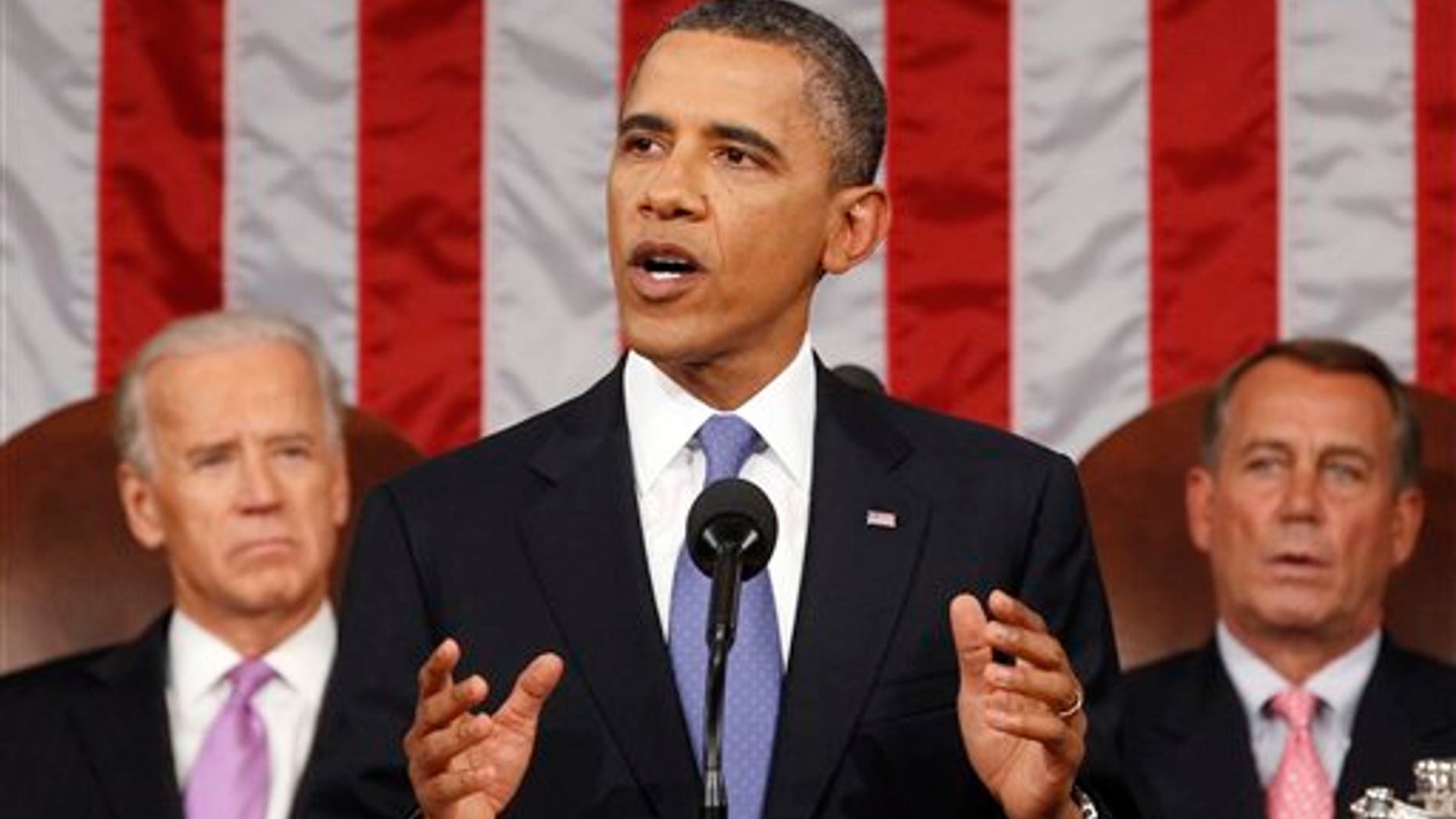 Sept 8: President Barack Obama delivers a speech to a joint session of Congress at the Capitol in Washington. Watching are Vice President Joe Biden and House Speaker John Boehner.