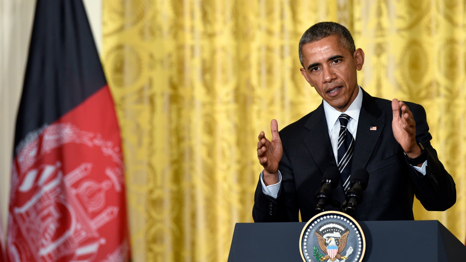 President Barack Obama speaks during a joint news conference with Afghanistan's President Ashraf Ghani, Tuesday, March 24, 2015, in the East Room of the White House in Washington. President Barack Obama said the U.S. will keep just under 10,000 troops in Afghanistan through the end of 2015 at the request of Afghanistan's new president, Ashraf Ghani. (AP Photo/Susan Walsh)