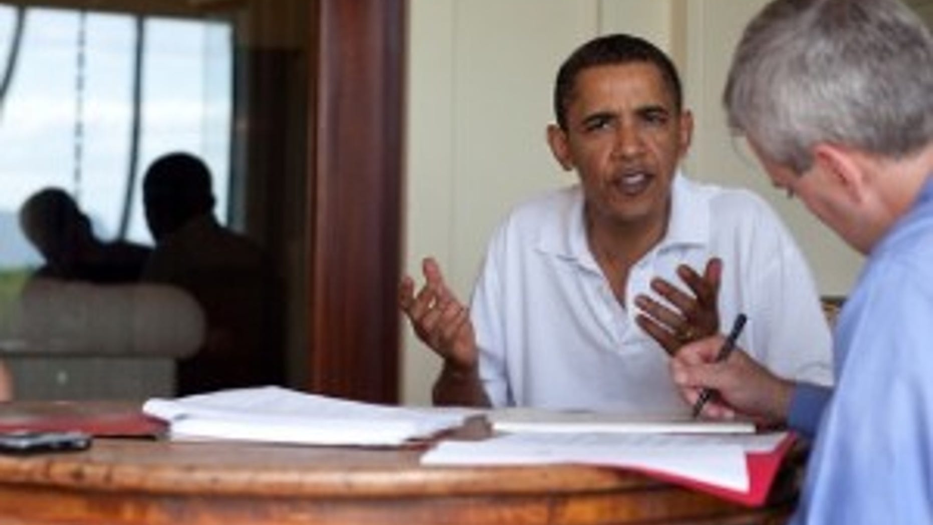 President Barack Obama meets with National Security Staff chief of staff Denis McDonough about updates concerning the attempted terrorist attack of an airliner on Christmas Day. This briefing occurred Dec. 29, 2009, in Kailua, Hawaii. The President has received updates throughout his vacation since the incident. (Official White House photo by Pete Souza)