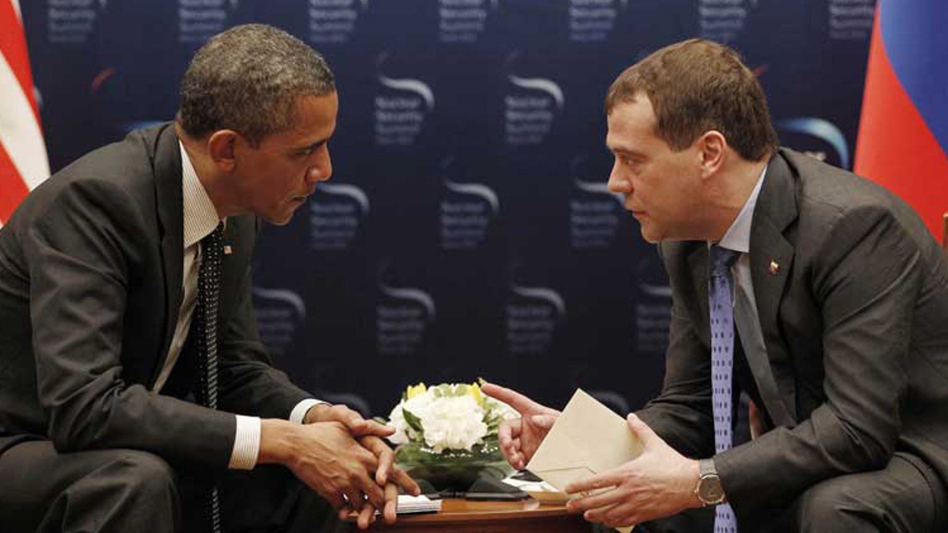 When President Obama met with Russian President Dmitry Medvedev in Seoul on March, 26, a live microphone picked up an indiscreet aside from Obama. (AP Photo/Pablo Martinez Monsivais)