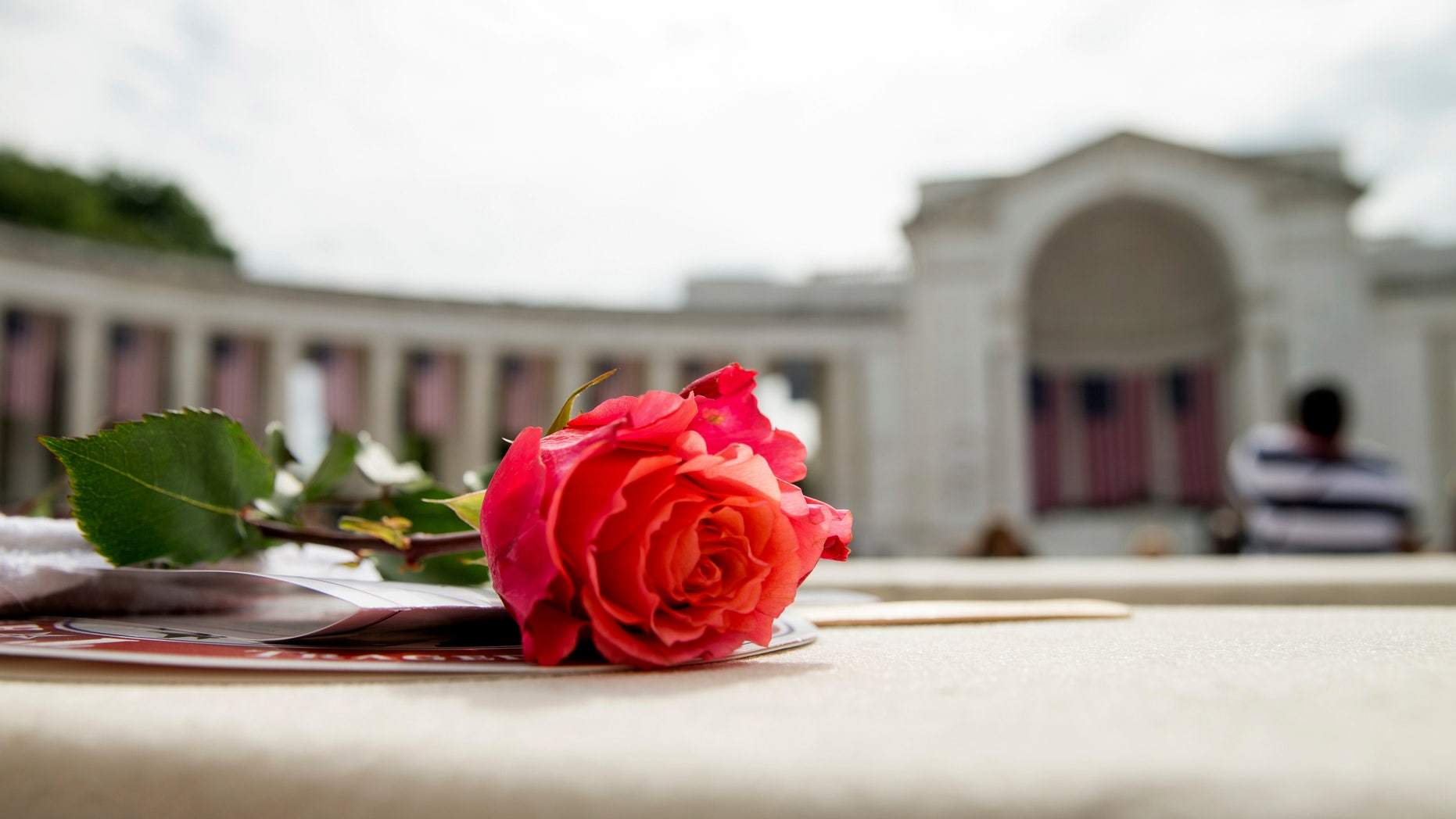 May 30, 2016: A rose is visible on a seat before President Barack Obama speaks at the Memorial Amphitheater of Arlington National Cemetery, in Arlington, Va., during a Memorial Day ceremony.