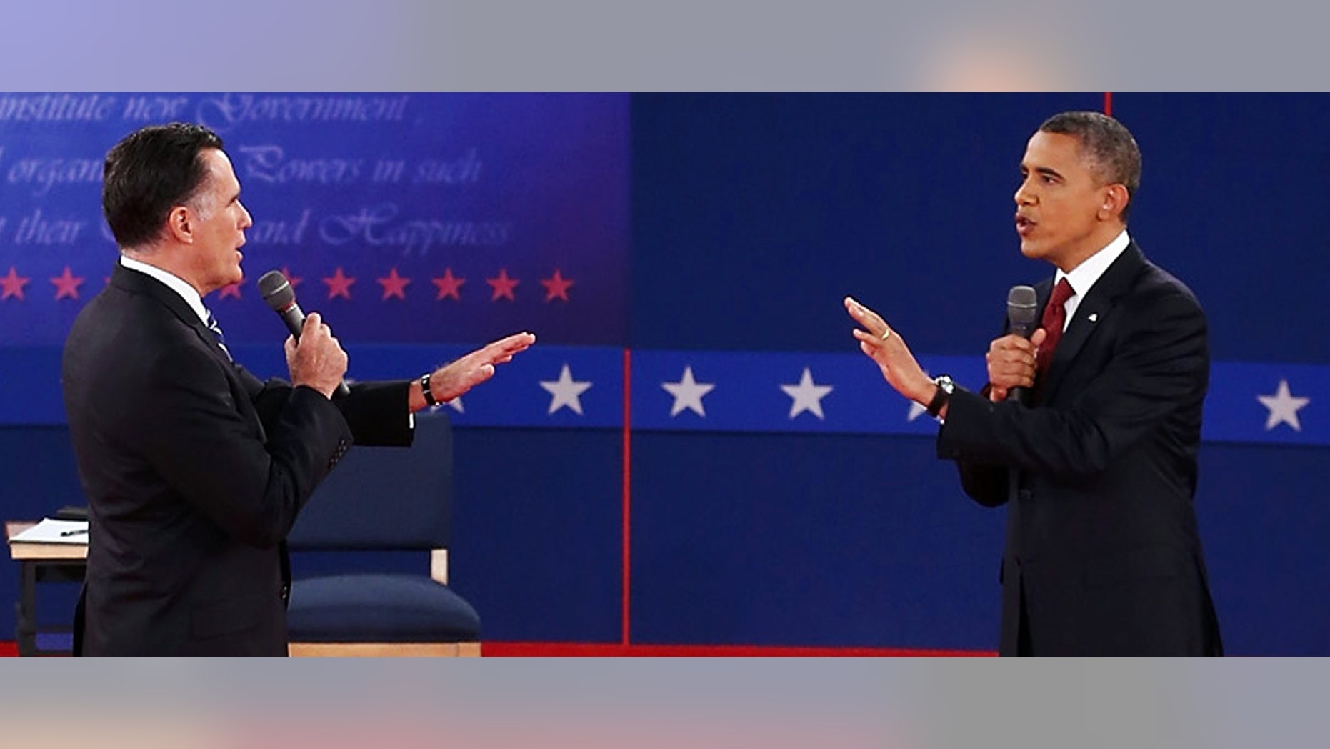 FiOCTOBER 16: Republican presidential candidate Mitt Romney (L) and U.S. President Barack Obama talk to each other during a town hall style debate at Hofstra University October 16, 2012 in Hempstead, New York. During the second of three presidential debates, the candidates fielded questions from audience members on a wide variety of issues. (Photo by Bruce Bennett/Getty Images)