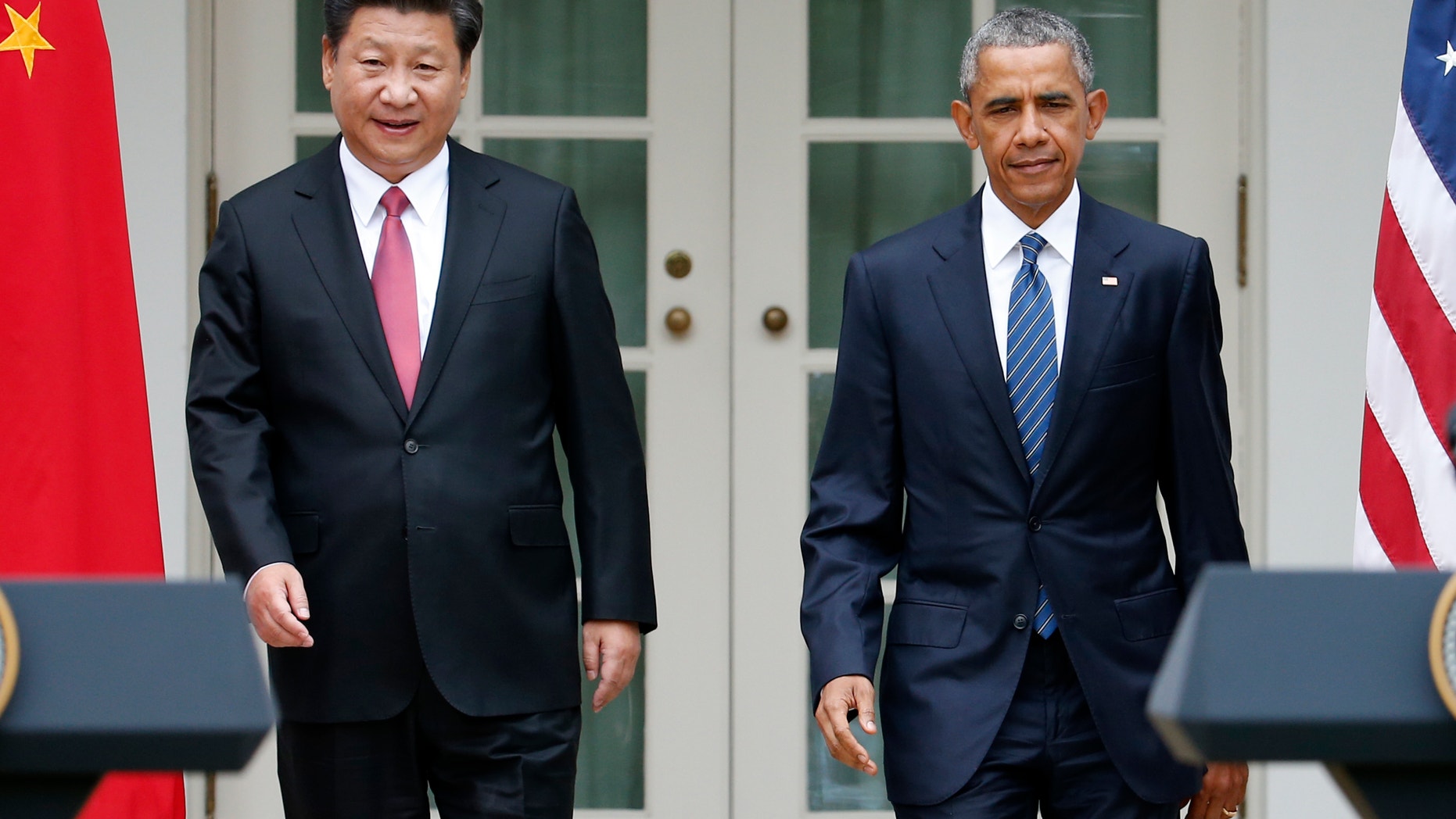 President Barack Obama and Chinese President Xi Jinping arrive for their joint new conference, Friday, Sept. 25,2015, in the Rose Garden of the White House in Washington. (AP Photo/Evan Vucci)