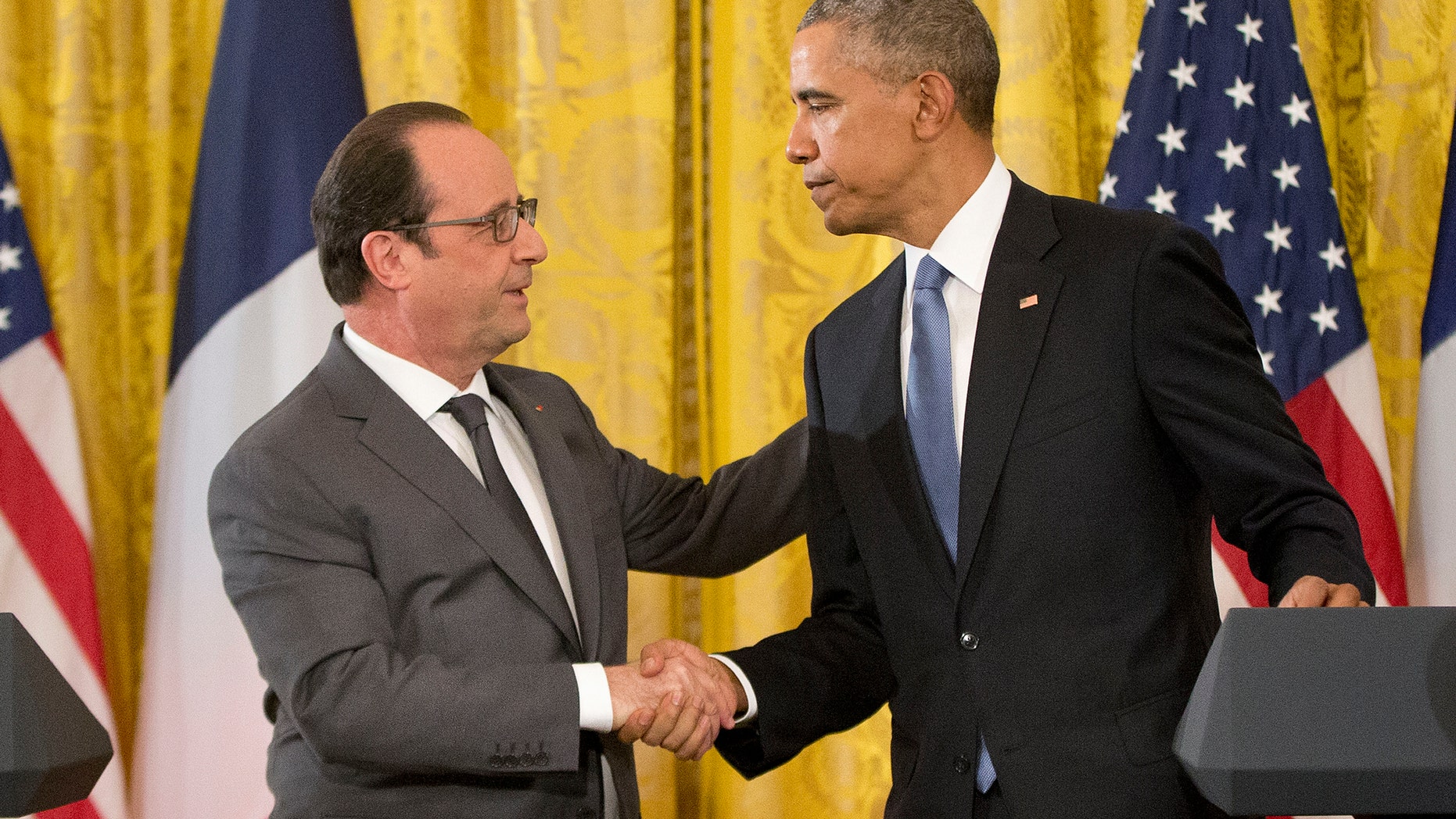 President Barack Obama shakes hands with French President Francois Hollande during their news conference in the East Room of the White House in Washington, Tuesday, Nov. 24, 2015. Hollande's visit to Washington is part of a diplomatic offensive to get the international community to bolster the campaign against the Islamic State militants. (AP Photo/Pablo Martinez Monsivais)