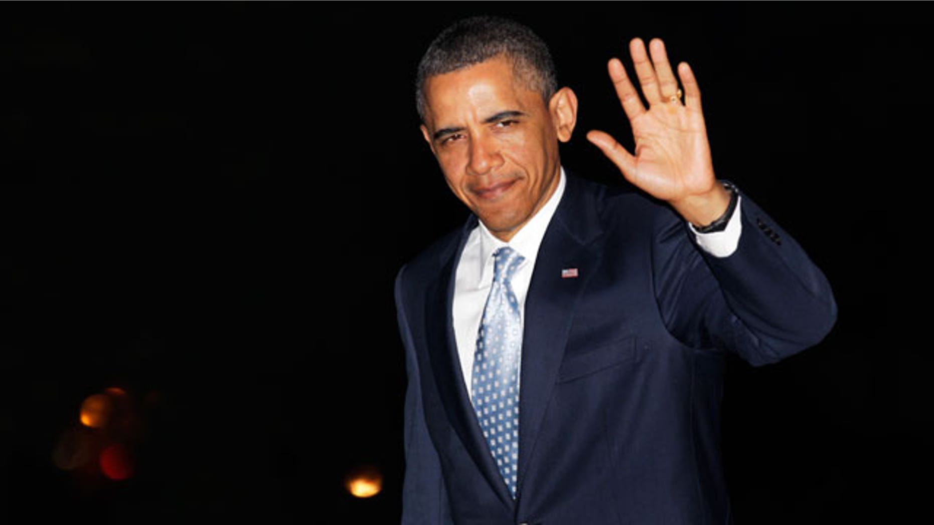 May 11: President Obama waves to media as he walks from Marine One to the White House, in Washington, as he travels from Texas.