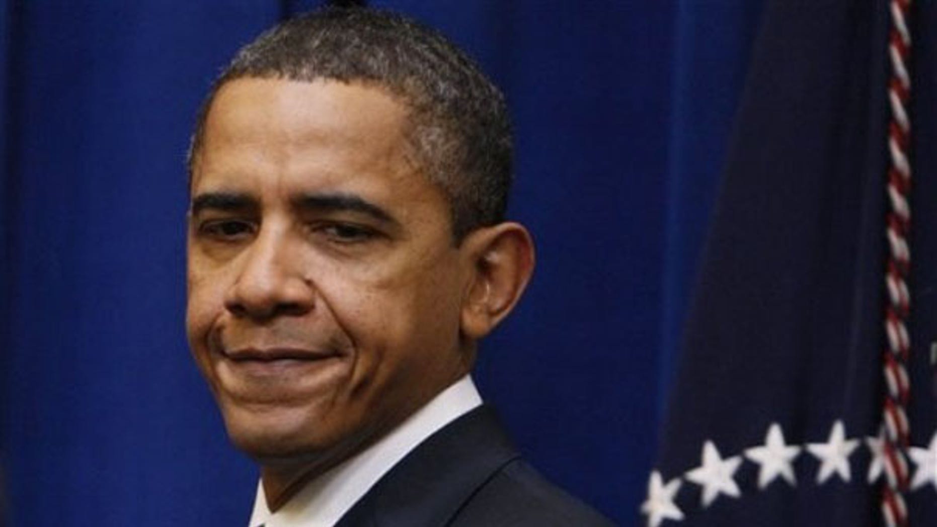 President Obama approaches the podium in the Executive Office Building in Washington Jan. 20. (AP Photo)