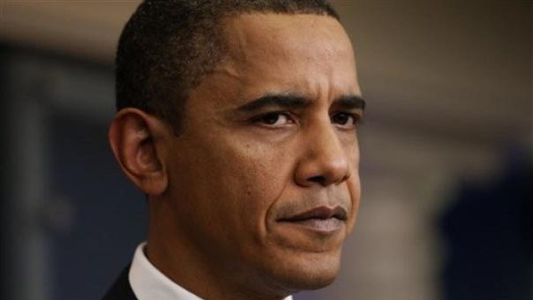 President Obama listens to a reporter's question as he makes an unannounced visit to the James Brady Briefing Room for the daily press briefing, Tuesday, Feb. 9, 2010, at the White House. (AP)