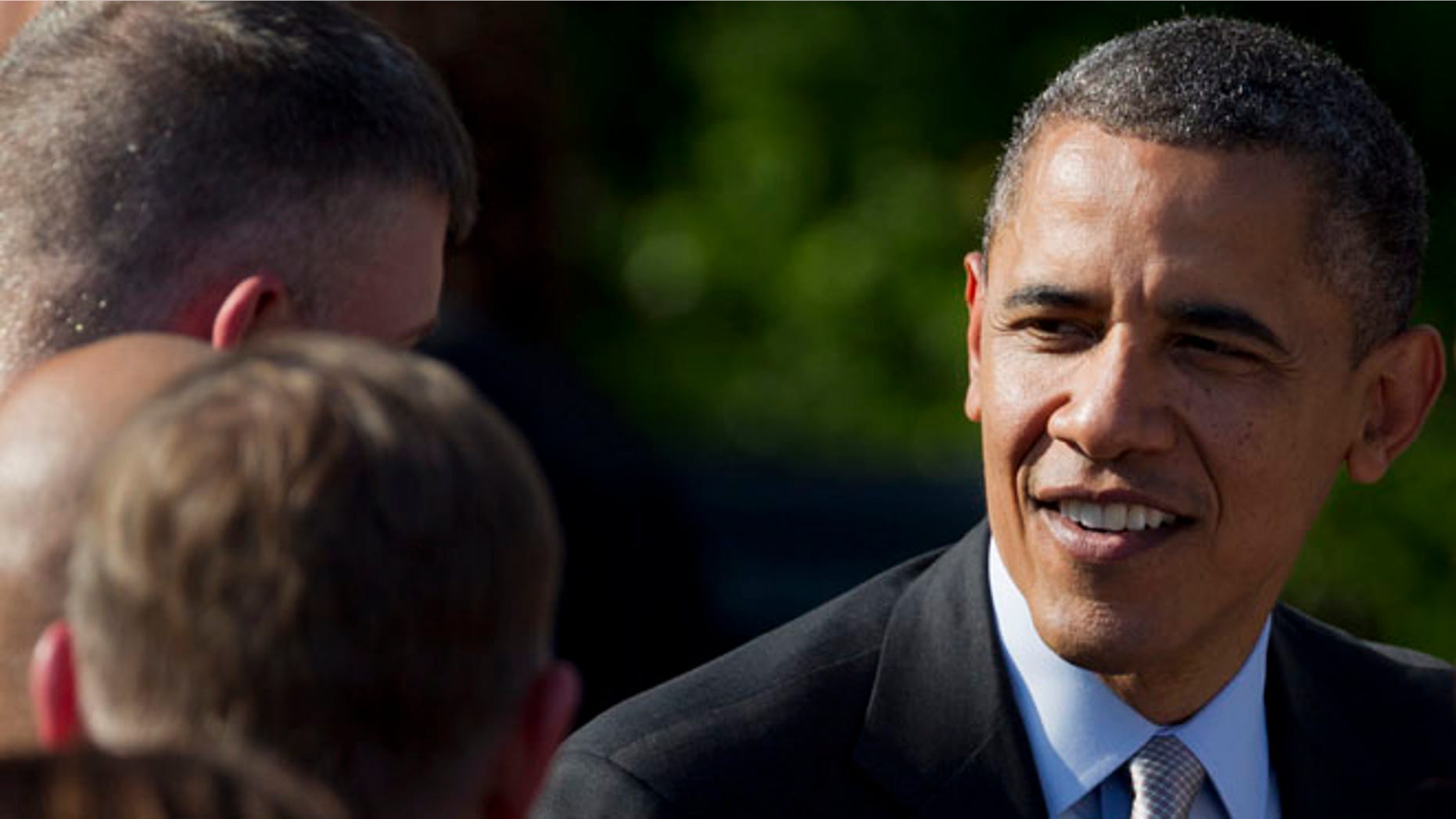 April 20, 2012: President Obama greets members of the military after a ceremony at the White House.
