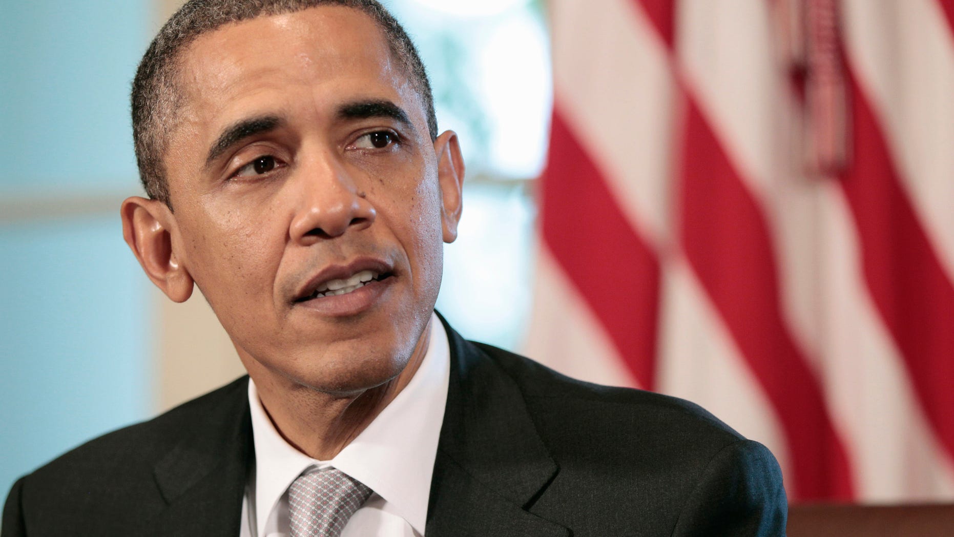 President Obama speaks to members of the media during a Cabinet meeting in the Cabinet Room of the White House in Washington, Wednesday, Aug., 3, 2011.