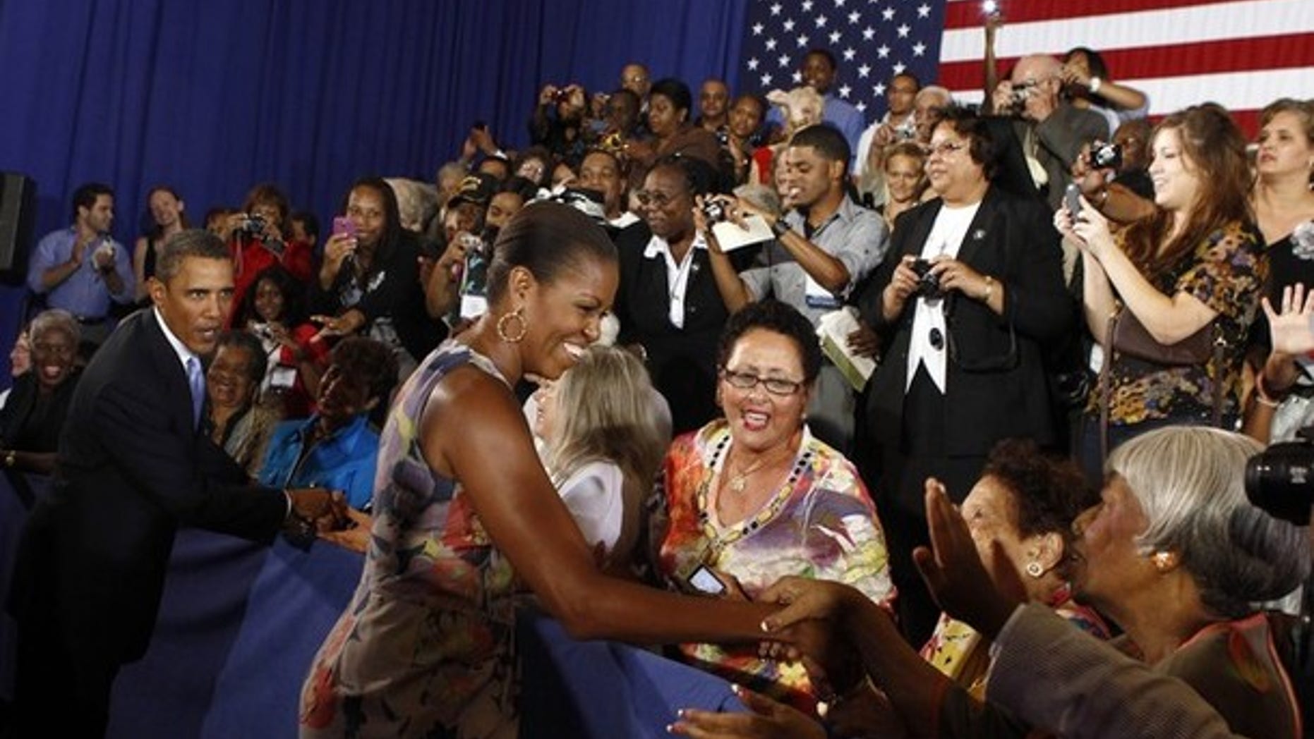 Sunday: President Obama and first lady Michelle Obama greet spectators as they arrive at Xavier University in New Orleans, La.