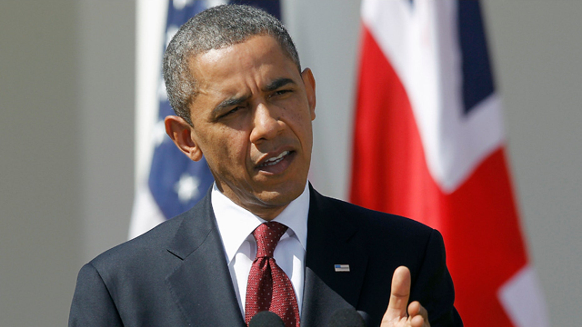 March 14, 2012: President Barack Obama answers a question during a joint news conference with British Prime Minister David Cameron of the Rose Garden at the White House in Washington.