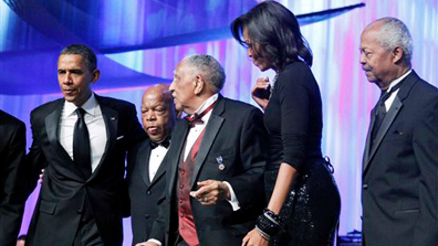 Saturday: President Obama, Rep. John Lewis, D-Ga., civil rights leader Rev. Joseph E. Lowery, first lady Michelle Obama, and CBC Foundation Chairman Rep. Donald M. Payne, D-N.J., stand on-stage during the Congressional Black Caucus Foundation Foundation Annual Phoenix Awards in Washington.