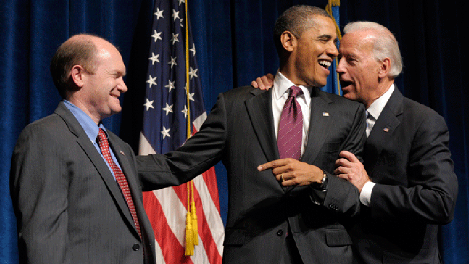 President Barack Obama talks with Vice President Joe Biden, right, after he was introduced at a fundraiser for Delaware Democratic Senate candidate Chris Coons, left, Friday, Oct. 15, 2010, at the Grand Opera House in Wilmington, Del. (AP)