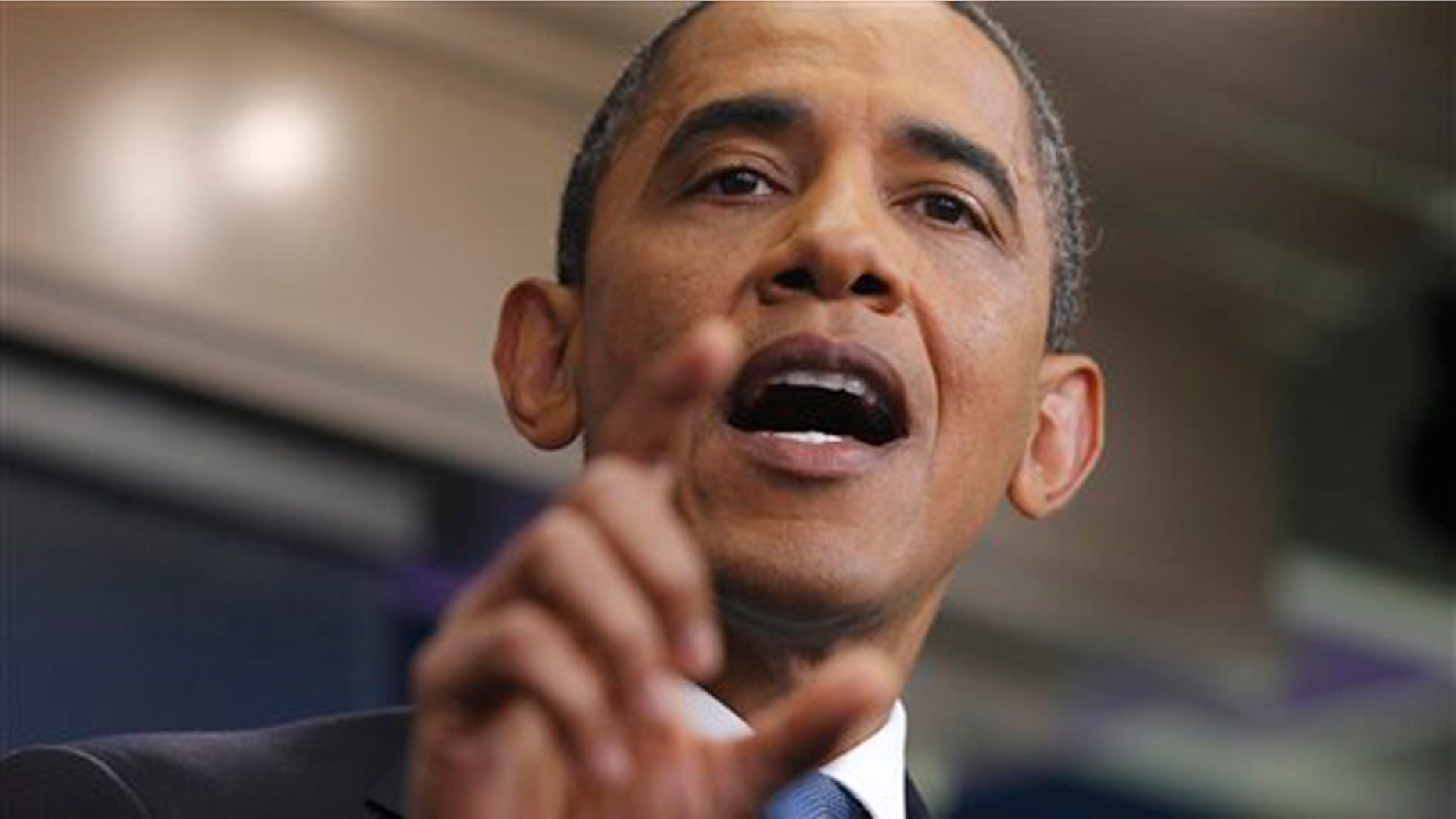 President Obama gestures during a news conference in the James Brady Press Briefing Room of the White House July 11.