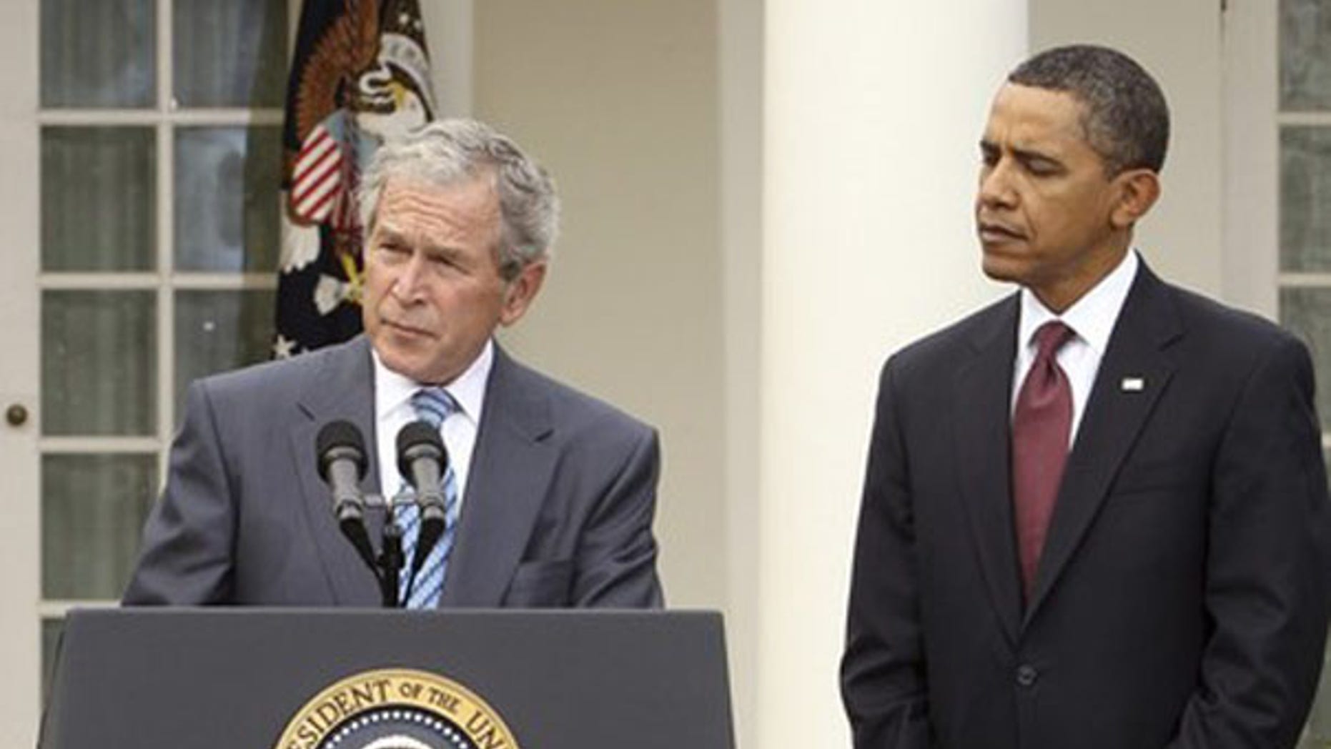 President Obama listens to former President George W. Bush in the Rose Garden of the White House Jan. 16. (Reuters Photo)