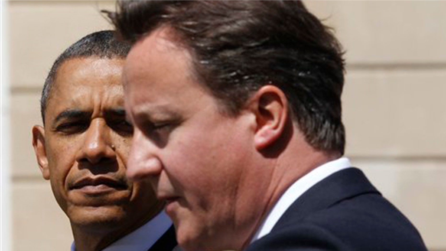 President Obama and British Prime Minister David Cameron speak during a joint news conference at Lancaster House in London May 25.