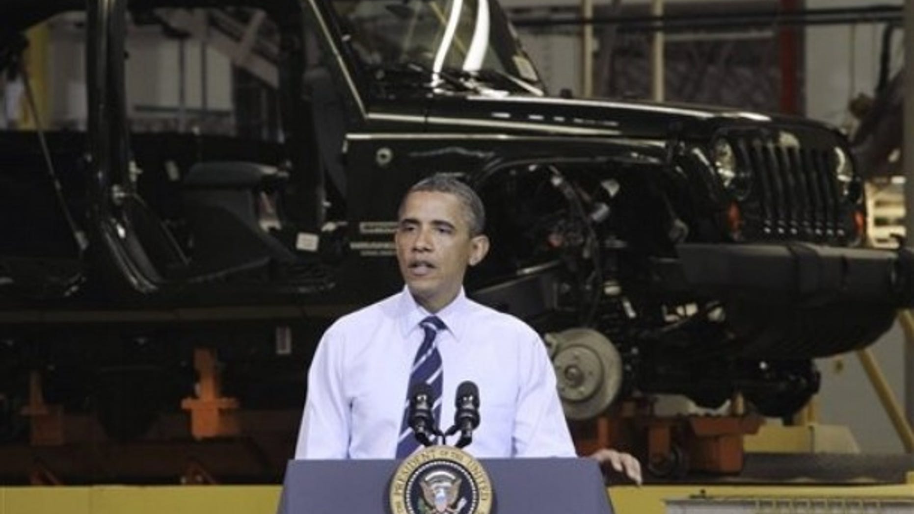 President Obama speaks at Chrysler Group's Toledo Assembly complex in front of a Jeep Wrangler, Friday, June 3, 2011, in Toledo, Ohio.