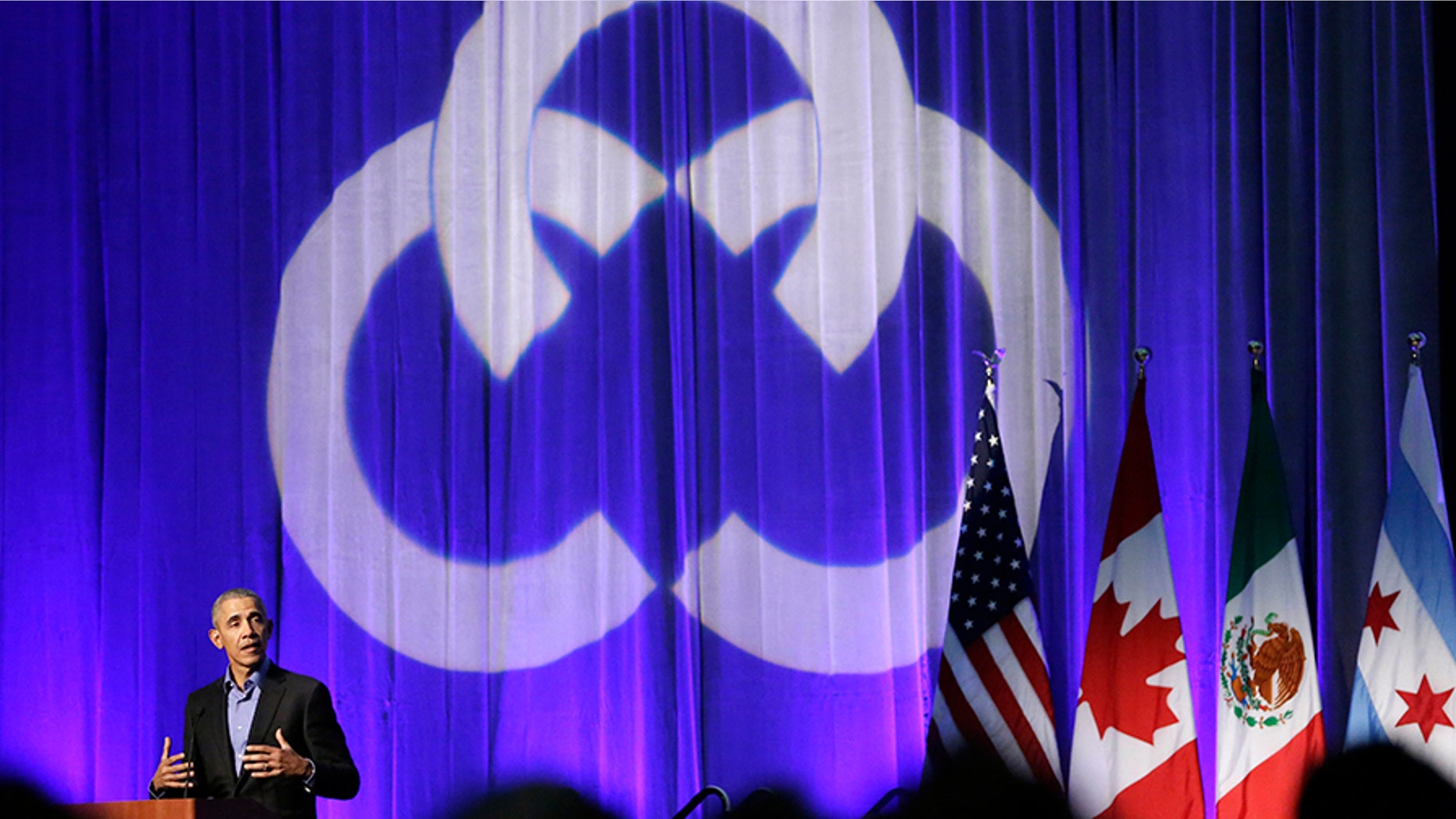 Former President Barack Obama address the participants at a summit on climate change involving mayors from around the globe Tuesday, Dec. 5, 2017, in Chicago. The conference comes after President Trump said the U.S. will pull out of the Paris agreement. (AP Photo/Charles Rex Arbogast)