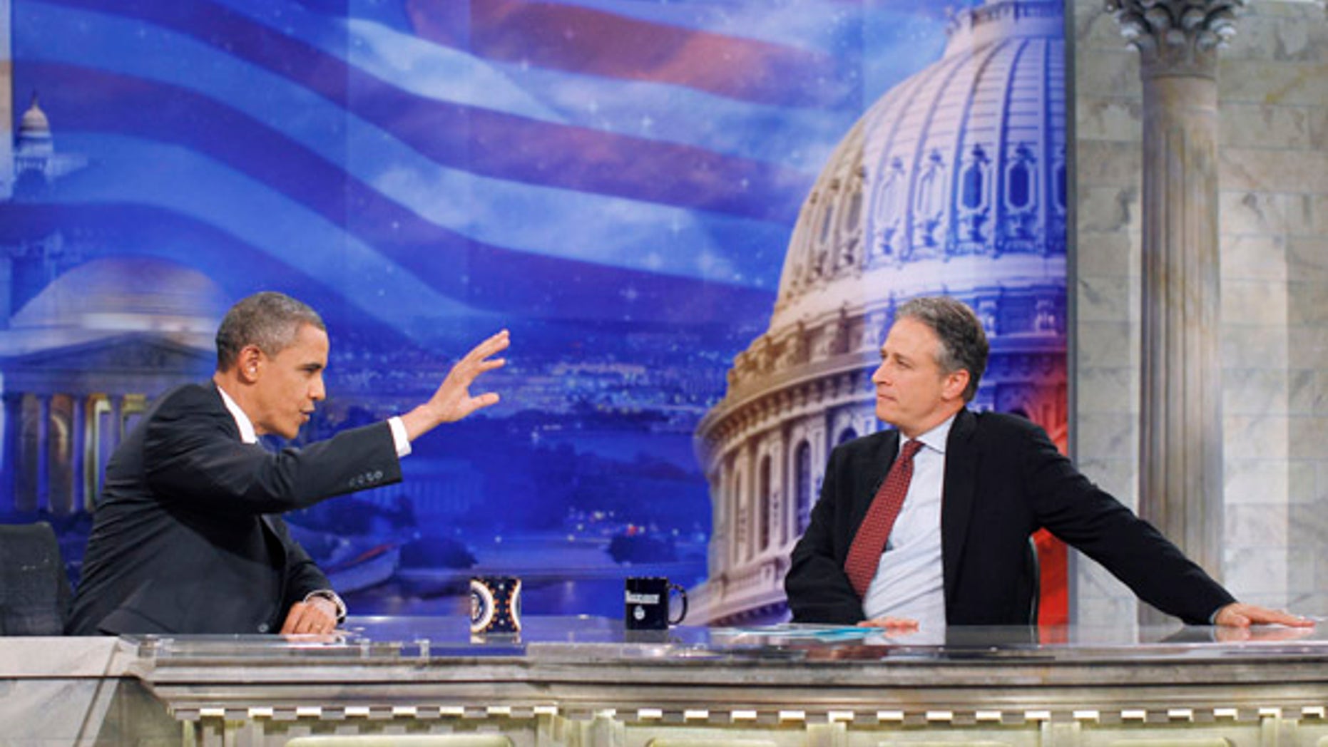 Wednesday: President Obama gestures during a commercial break as he talks with host Jon Stewart at a taping of Comedy Central's "The Daily Show with Jon Stewart," in Washington.