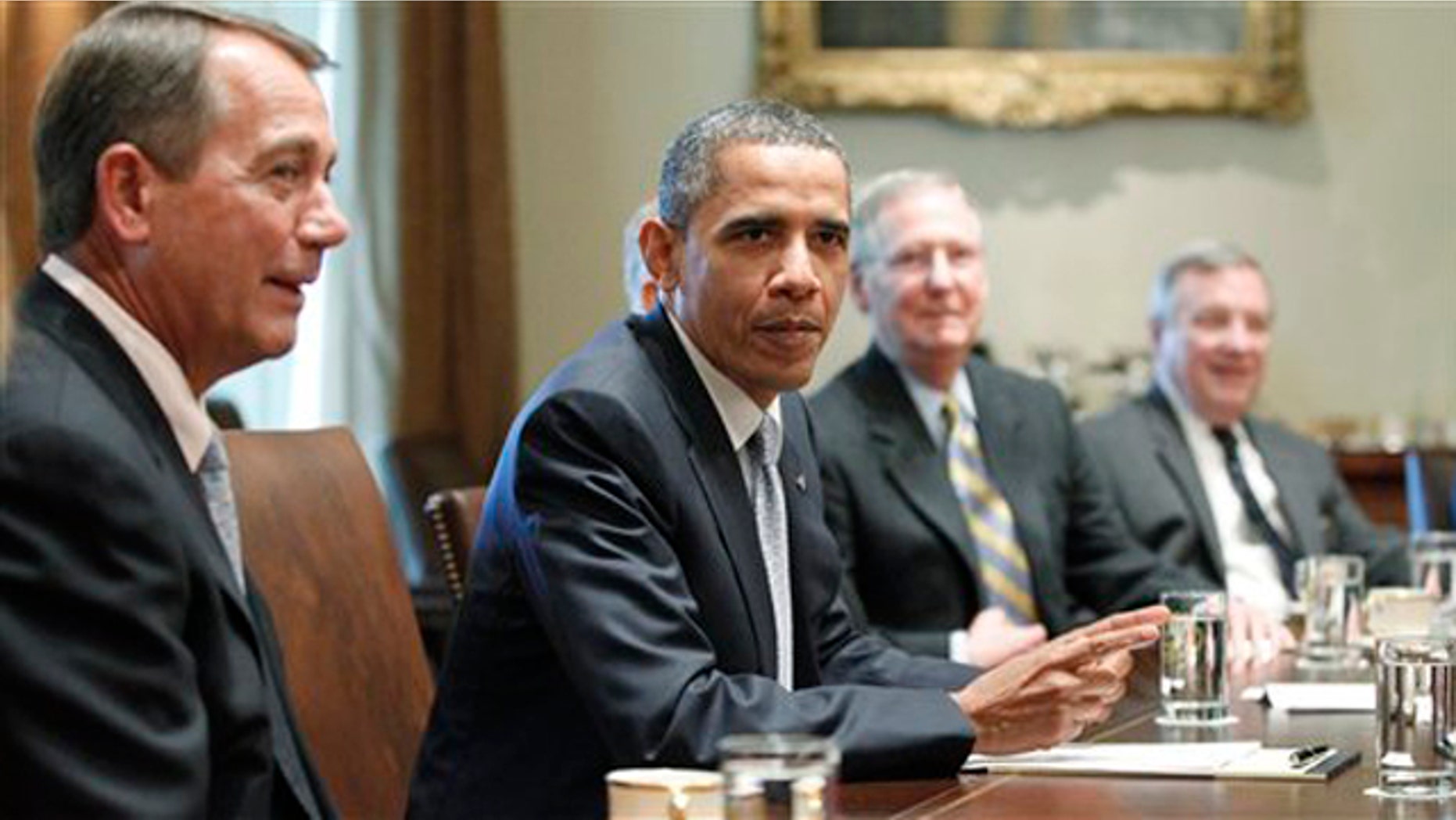 President Obama sits with House Speaker John Boehner, Senate Minority Leader Mitch McConnell and Sen. Dick Durbin as he meets regarding the debt ceiling in the Cabinet Room of the White House July 13.
