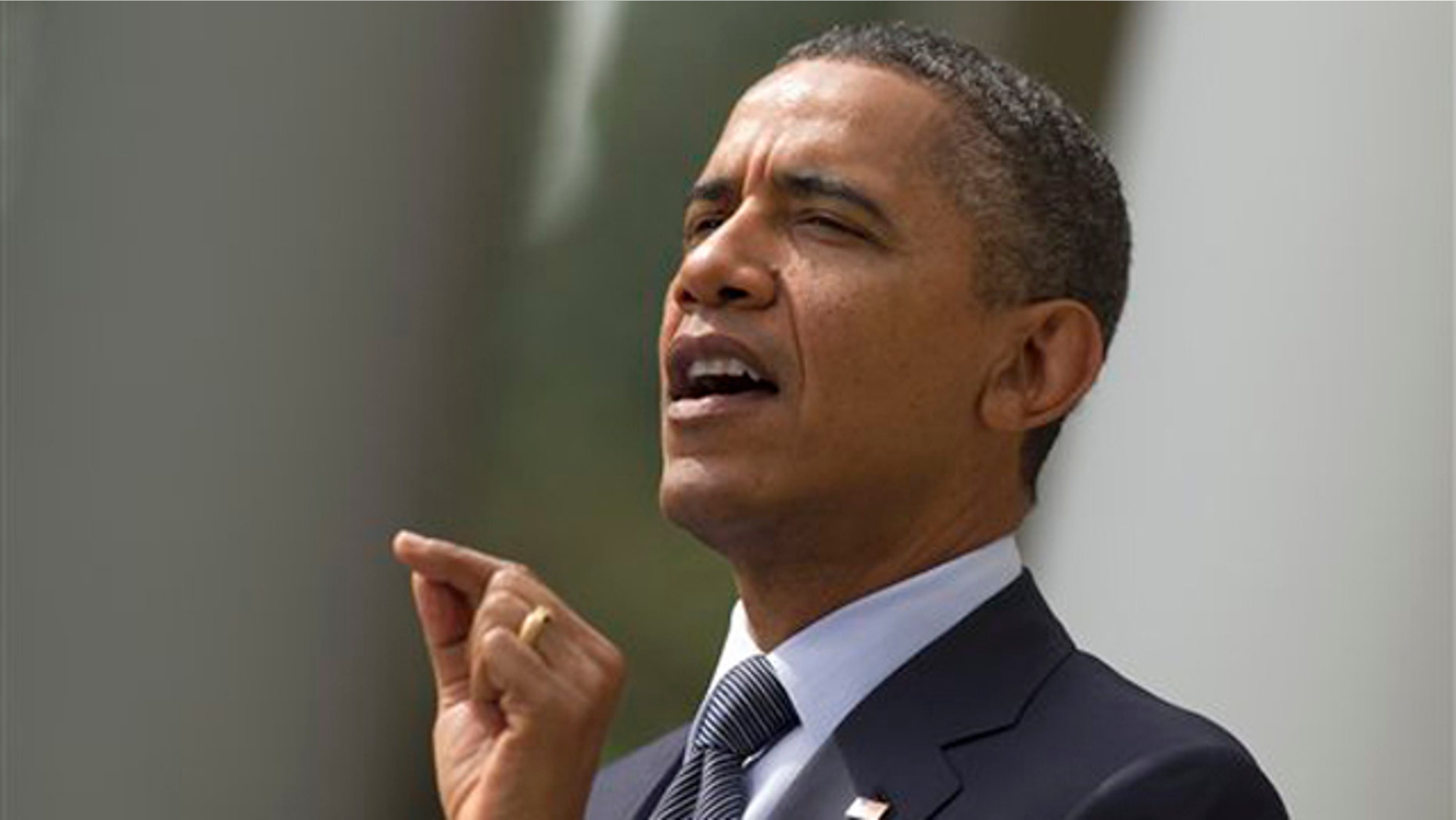 President Obama gestures while speaking in the Rose Garden of the White House in Washington Sept. 19.