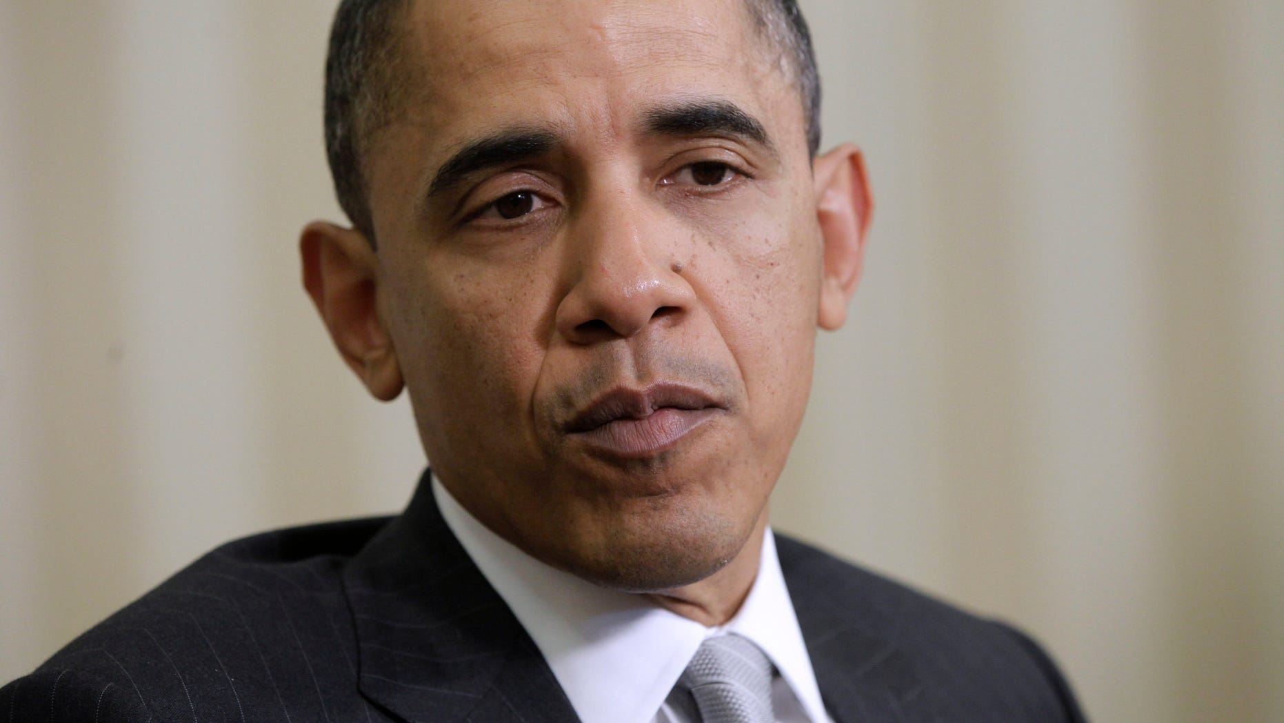 President Barack Obama speaks to reporters in the Oval Office of the White House in Washington, Monday, March 14, 2011, during his meeting with Danish Prime Minister Lars Lokke Rasmussen. (AP)