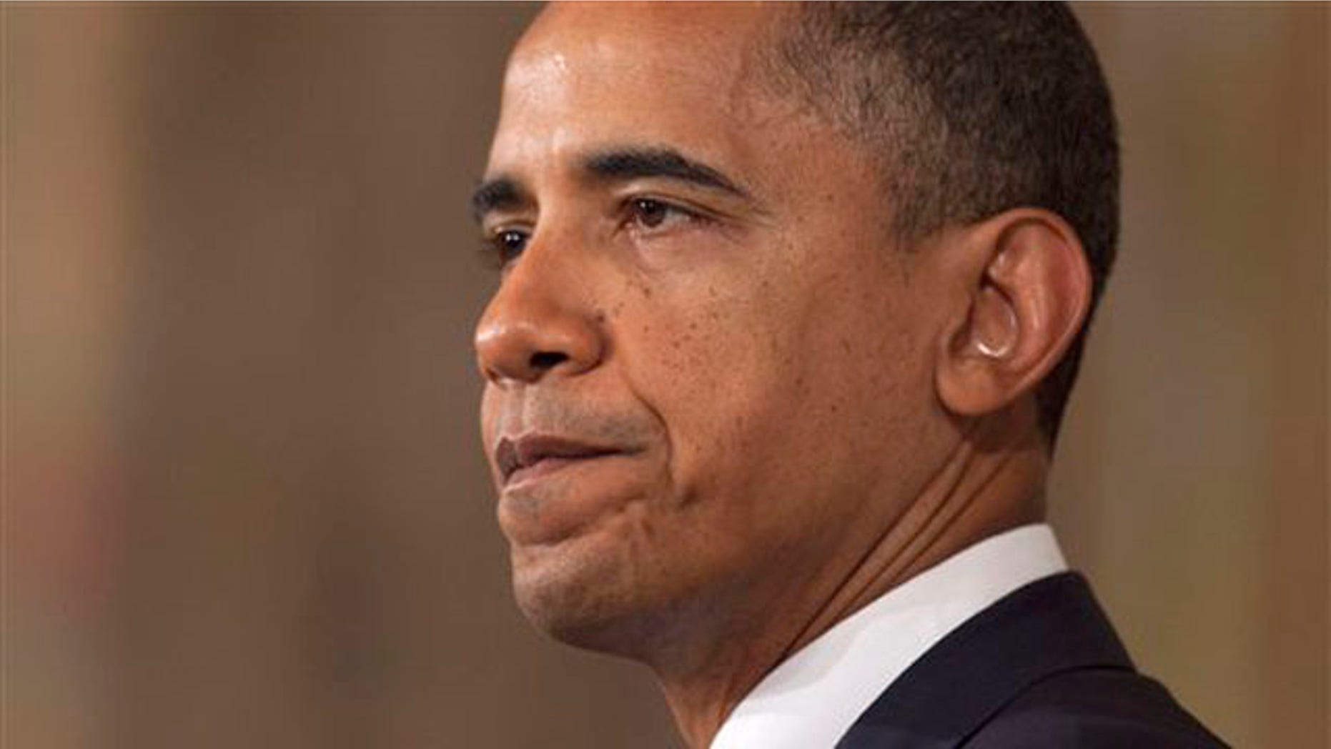Monday: President Obama pauses as he speaks in the State Dining Room of the White House on the Standard & Poor's downgrade of U.S. credit risk.