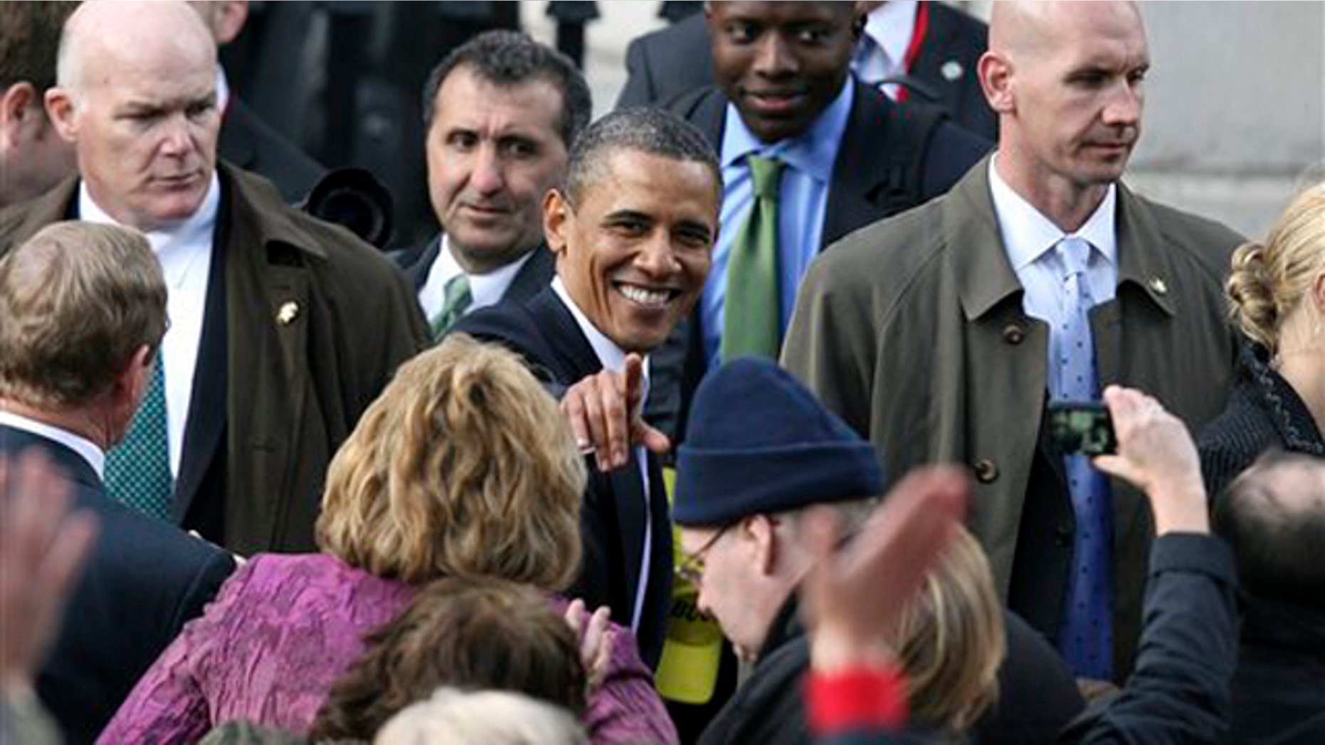 President Obama greets the crowd after addressing thousands of people in Dublin during his visit to Ireland May 23.