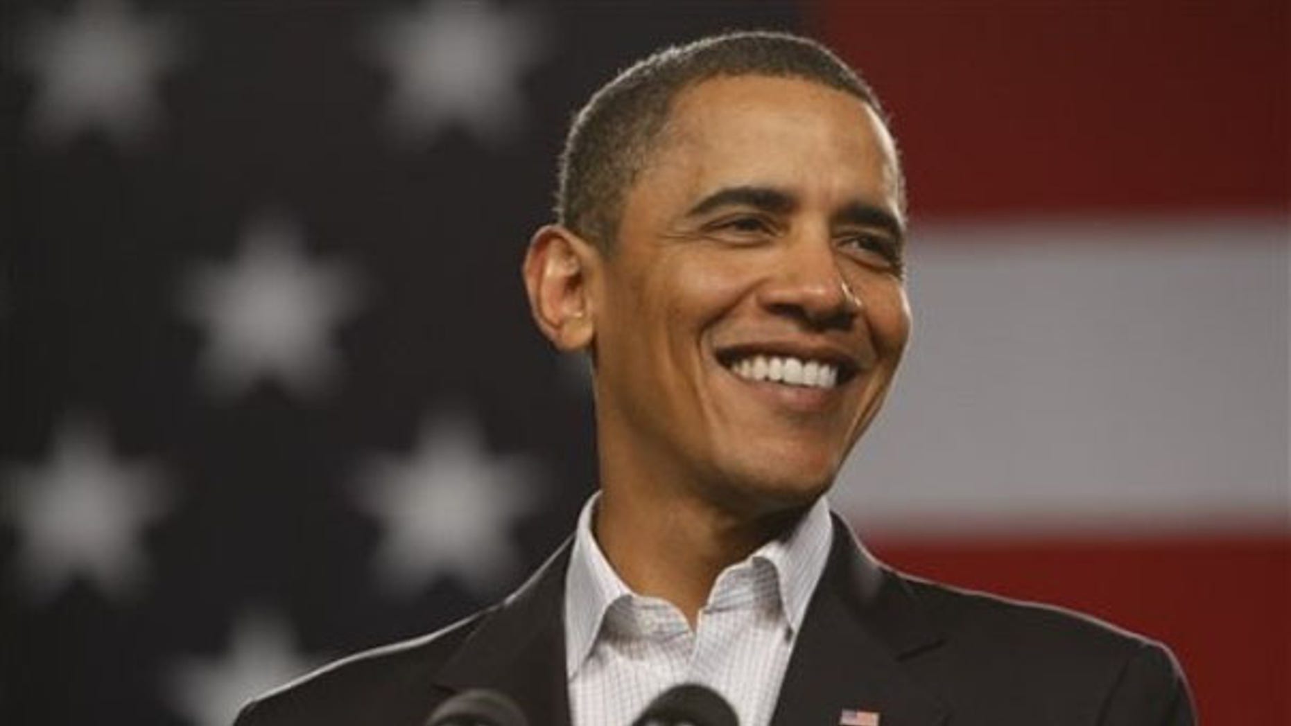 Friday: President Obama smiles at a town hall meeting at Lorain County Community College in Elyria, Ohio. (AP Photo)