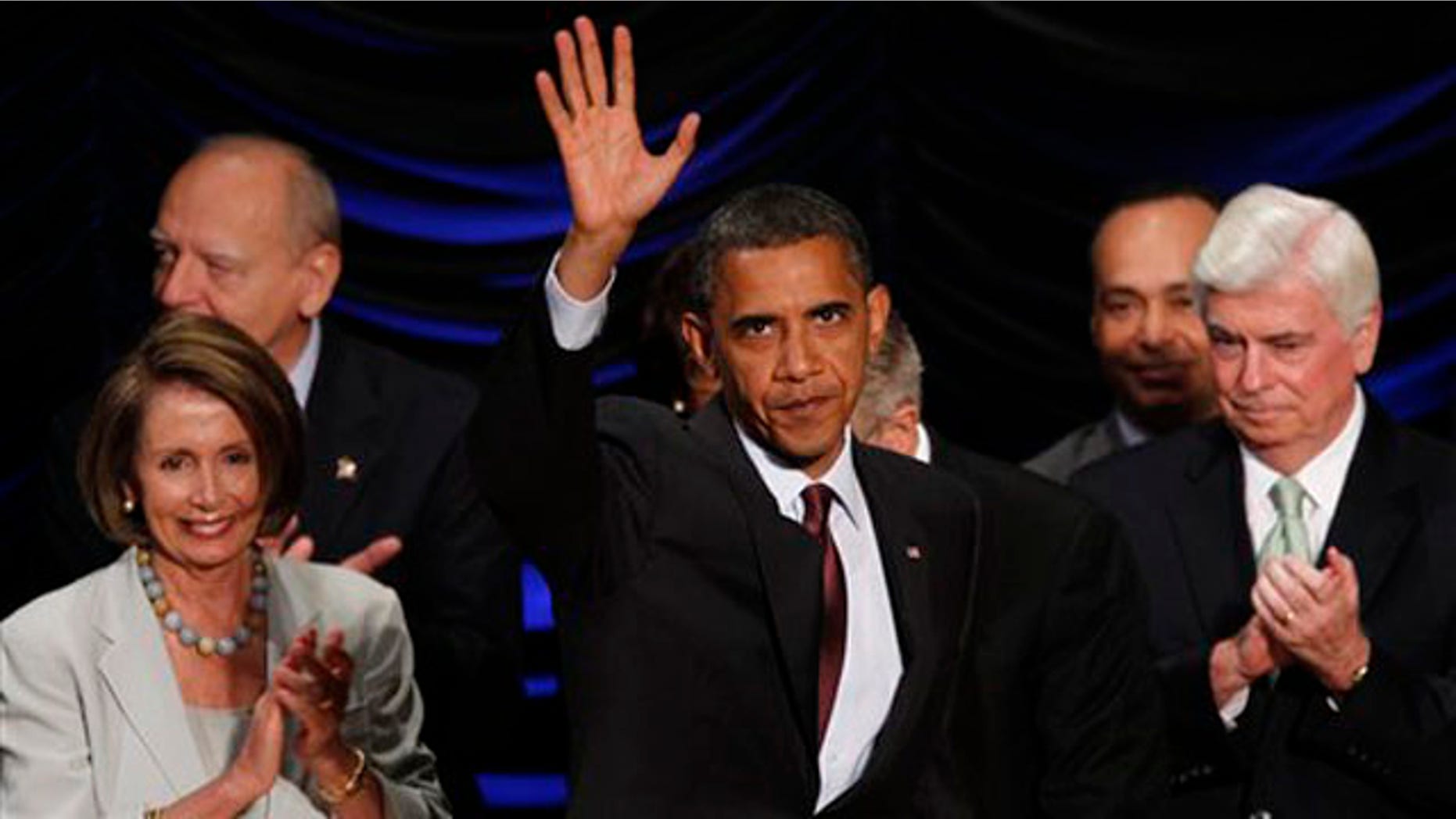 President Obama takes the stage before signing the Dodd-Frank Wall Street Reform and Consumer Protection financial reform bill in Washington July 21. (AP Photo)