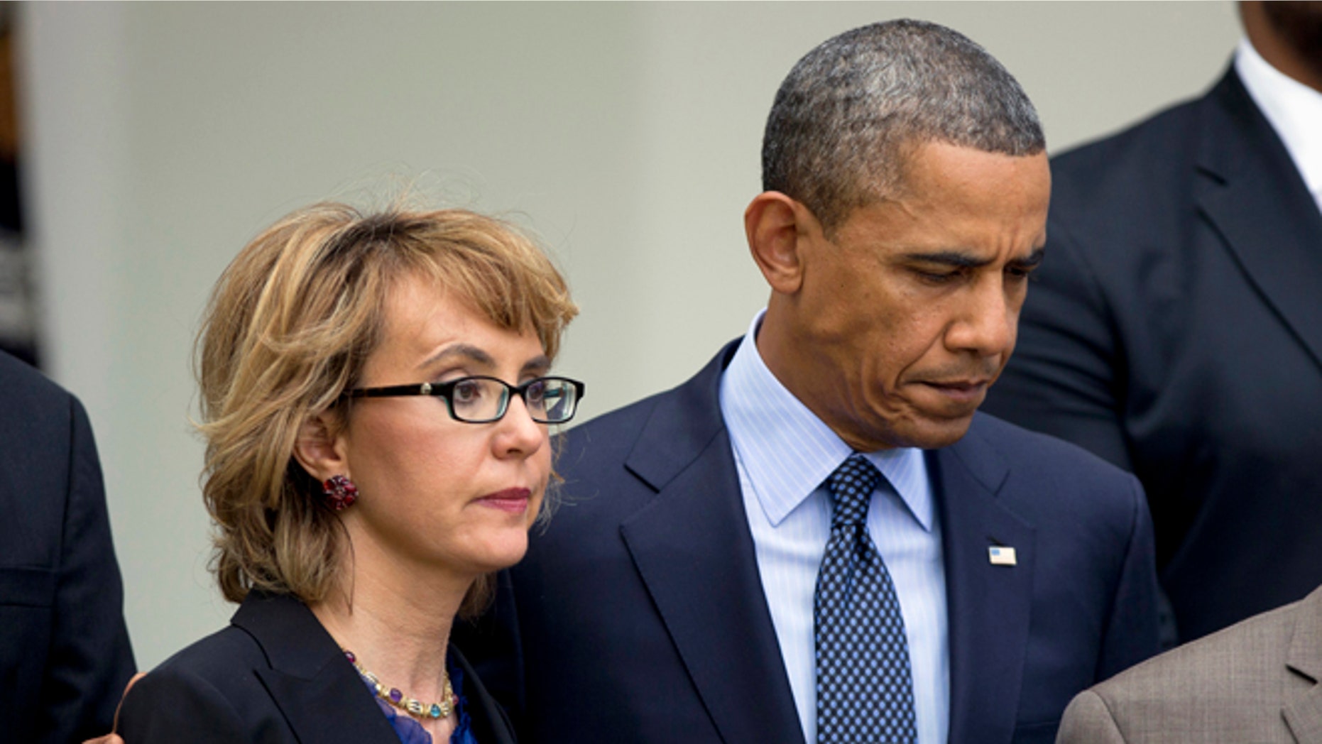 April 17, 2013: President Obama puts his arm around former Arizona Rep. Gabrielle Giffords before speaking in the Rose Garden at the White House in Washington about measures to reduce gun violence.