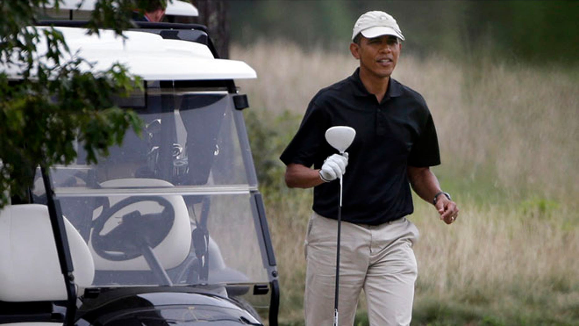 Aug. 18, 2013: President Obama prepares to tee off while golfing at Vineyard Golf Club in Edgartown, Mass.