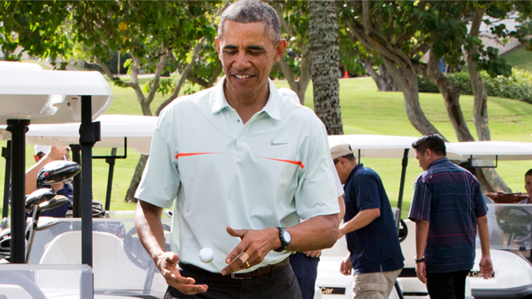Dec. 24, 2014: President Obama tosses a golf ball between his hands after finishing the 18th hole at Marine Corps Base Hawaii's Kaneohe Klipper Golf Course in Kaneohe, Hawaii.