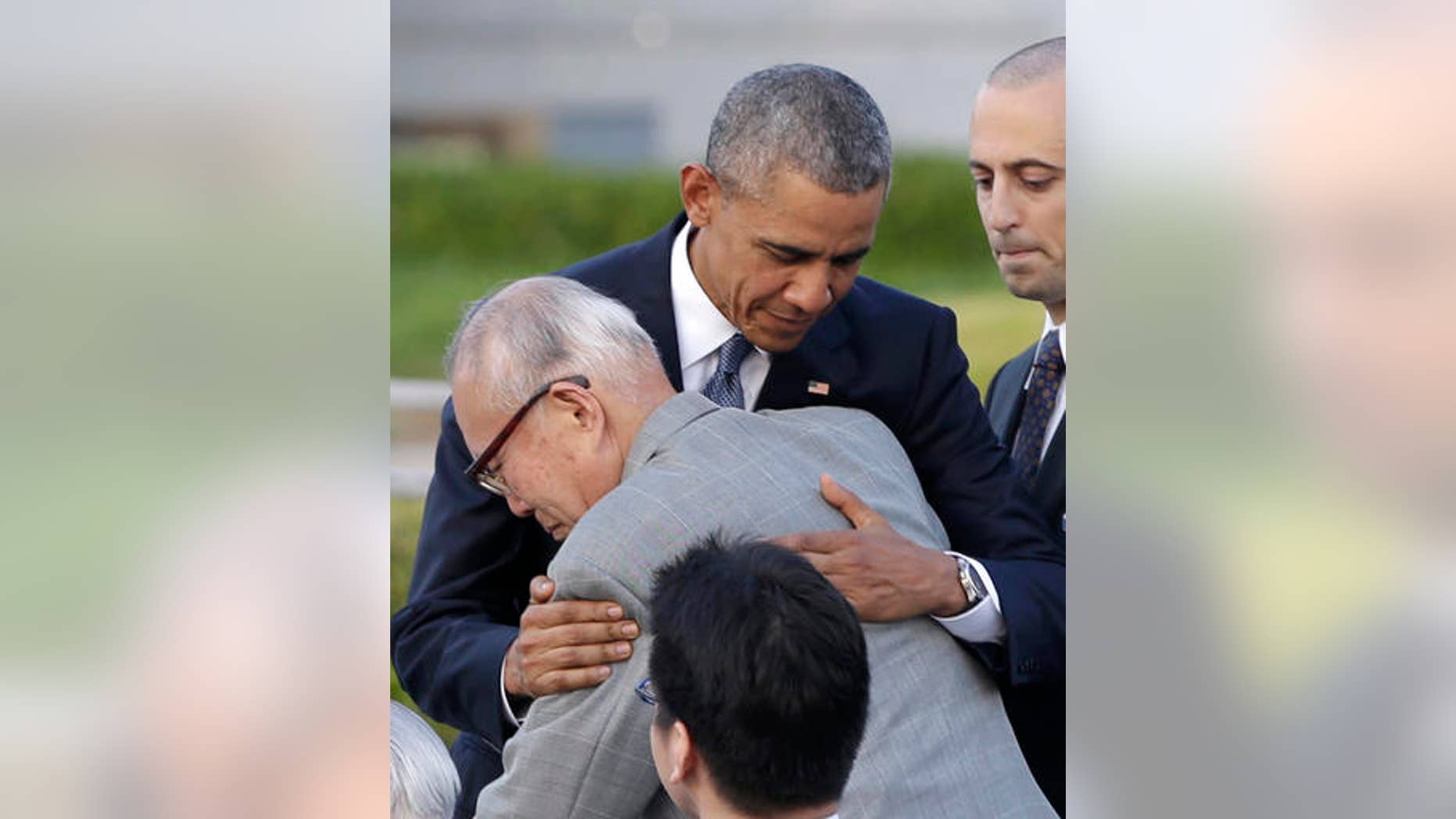 U.S. President Barack Obama hugs Shigeaki Mori, an atomic bomb survivor; creator of the memorial for American WWII POWs killed at Hiroshima, during a ceremony at Hiroshima Peace Memorial Park in Hiroshima, western, Japan, Friday, May 27, 2016. Obama on Friday became the first sitting U.S. president to visit the site of the world's first atomic bomb attack, bringing global attention both to survivors and to his unfulfilled vision of a world without nuclear weapons. (AP Photo/Carolyn Kaster)