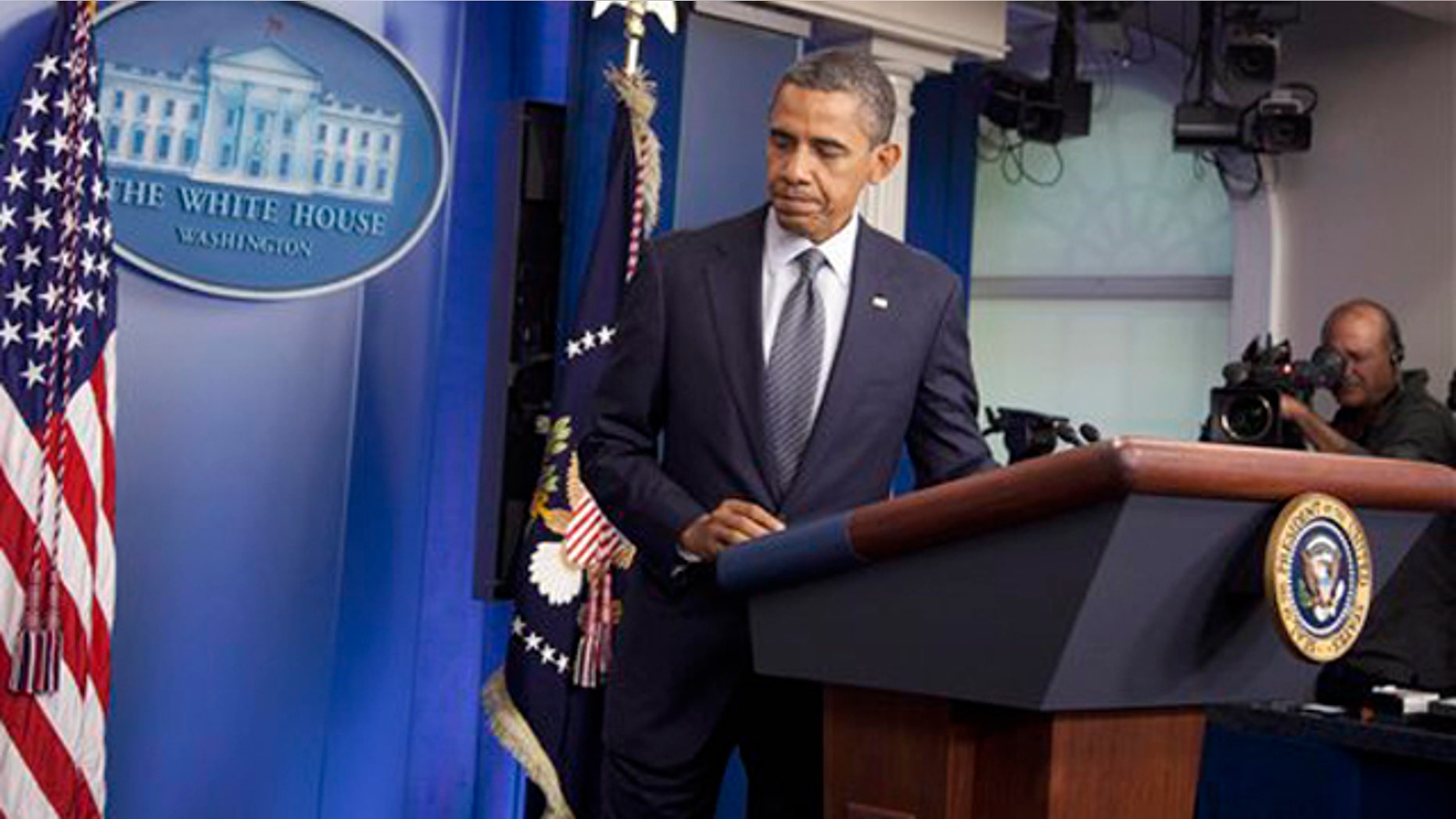 Oct. 21, 2011: President Obama leaves after speaking in the briefing room of the White House.