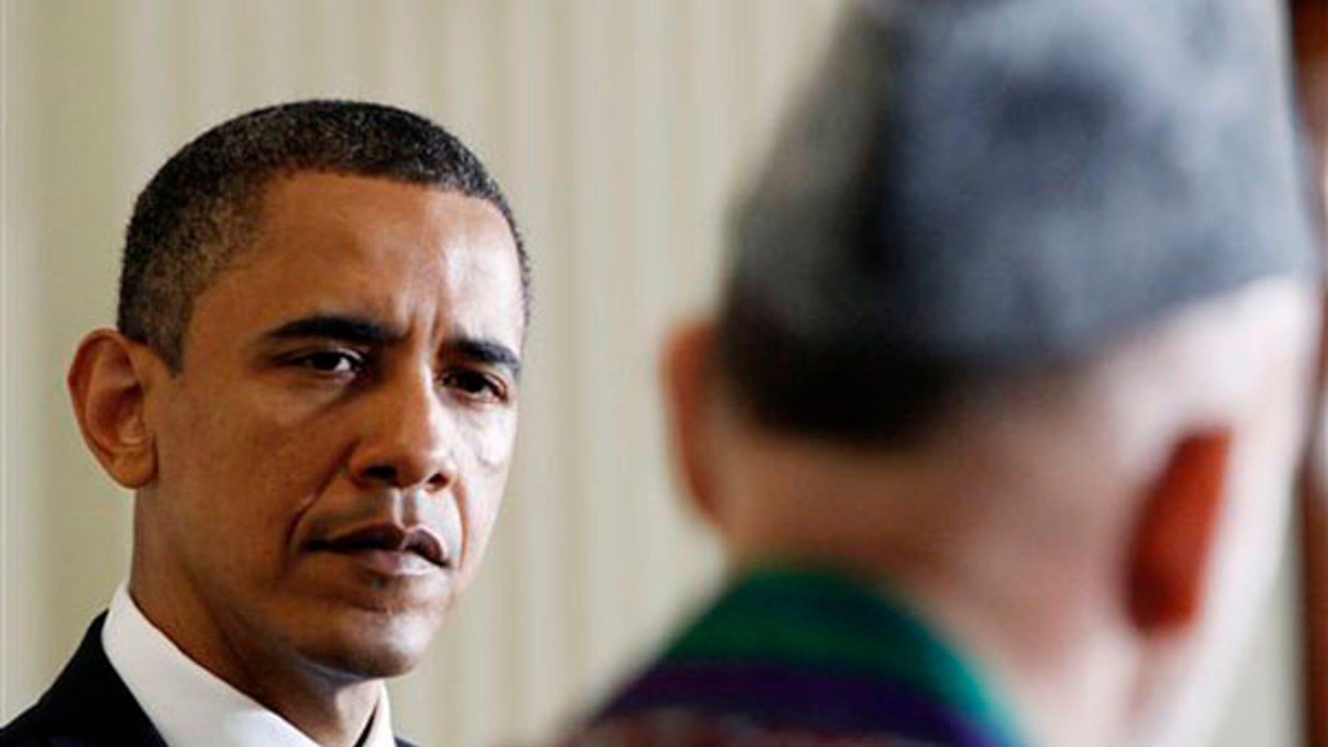 President Obama and Afghan President Hamid Karzai are shown during their joint news conference at the White House in Washington May 12. (AP Photo)