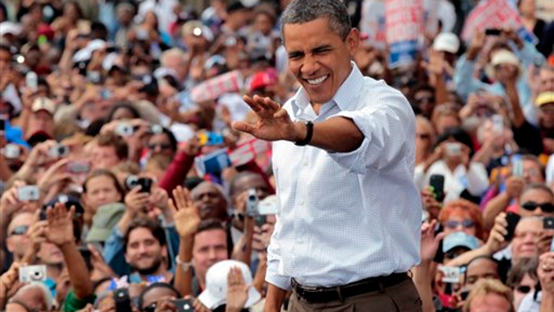 Sept. 5: President Barack Obama waves to supporters during a Labor Day speech at Detroit's Renaissance Center, headquarters of General Motors, in Detroit, Mich.
